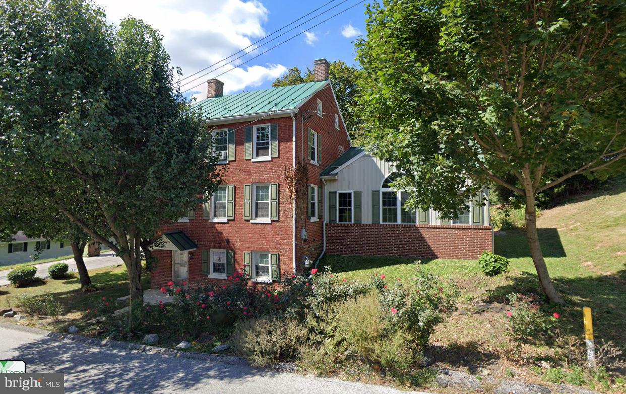Charming brick colonial in Southern York County schools. This well maintained home features a newly remodeled kitchen,  bright open family room with gas fireplace, dining room with vaulted ceilings and exposed brick wall, 3 bedrooms as well as some bonus rooms, and a walkout basement with laundry room and utility rooms. Exterior features include a large 2 car garage, side porch, plenty of driveway space, mature trees, and more. Located close to 83 and the MD / PA line, walking distance to the rail trail,  close to lakes, parks, dining, and shopping.