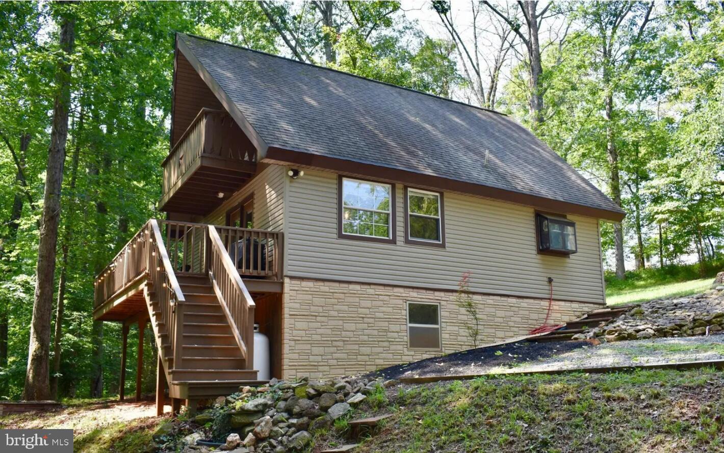 Escape to the tranquility of one of Madison County's hidden gems (WhiteOakLake). Nestled in the foothills of Virginia's Blue Ridge Mountains, this charming lakefront home provides an exceptional blend of natural beauty, privacy, and recreation. Enjoy waterfront living in a peaceful community centered around a quiet electric-motor-only lake. Wake up to stunning water views, spend your days fishing, kayaking, paddleboarding, or relaxing by the shore, and end each evening with spectacular sunsets over the water. Just minutes from Madison and a short drive to Charlottesville, Shenandoah National Park, and Central Virginia's wineries and outdoor attractions, this property  as a primary residence, weekend retreat, or investment opportunity.