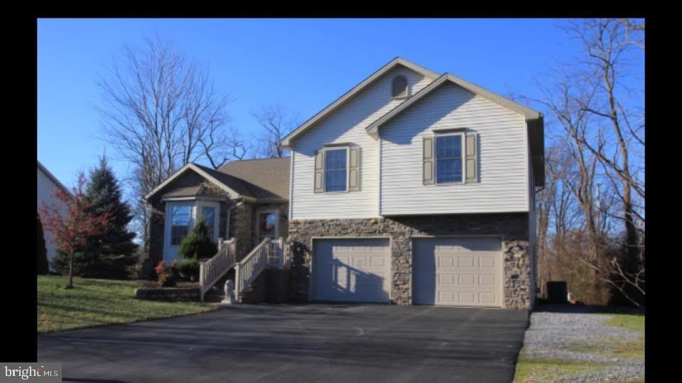 Possession not until June 1, 2025.  Lovely tri level home on nice, quiet .64 acre lot, which backs up to woods and farmland.  Enjoy a large, open concept living area, 3 bedrooms, and a gas fireplace in the family room. There is a finished, walk out basement with a separate huge storage space and a 2 car garage. Your kitchen has a nice pantry and there is also a laundry room.  You will find two full bathrooms in this home with the master bedroom having its own soaking jet tub! Outside is a  large, fenced in yard where you can enjoy the gazebo, 2 separate sheds for outdoor equipment and tools,  and a chicken coop where you can raise your own chickens. You are only .5 miles from a new nature park. All appliances convey, with the exception of the freezers and the fridge in the garage.   Don't let this one slip away. Schedule your showing today!