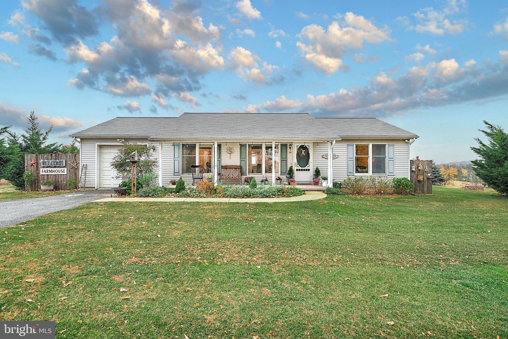 What a find!  This 2 Bedroom, 2 Bath rancher is situated on 2.14 private acres, in a convenient location just outside Westminster.  Experience true one-level living in this cozy home, offering a large country kitchen with breakfast bar, woodburning fireplace and two generous bedrooms with adjoining full baths.  Enjoy great views of the fall foliage, watch the wildlife roam or the snow fall from your three-season sunroom, back patio and full front porch.   Try your hand at homesteading or just enjoy puttering around your own little slice of heaven, with its natural landscaping, flower beds with perennials, vegetable garden and even your own chicken coop (chicken included!).  The full unfinished basement provides ample storage, and can easily be finished for even more living space!  Extra surprises include the adorable shed currently used as a studio/office and separate storage area, and the above ground mini-pool for those hot summer days!  You will not be disappointed at all this property and home have to offer.