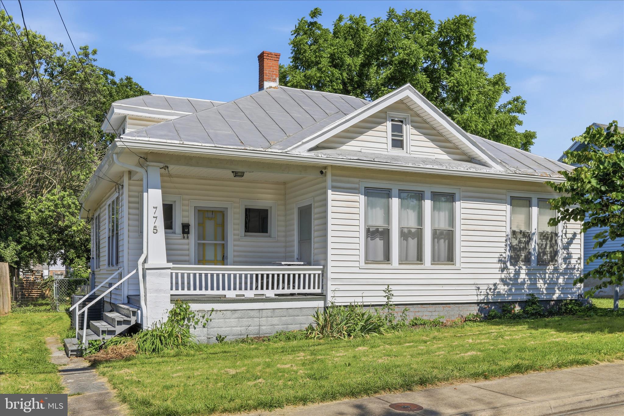 Price Reduced!! This charming bungalow-style home exudes warmth and character. Step inside to discover a cozy living space adorned with wood floors and built-in shelving. The country-style kitchen invites culinary creativity and includes new cabinetry. Three bedrooms provide ample room for relaxation plus a bonus room on the main level. The attic level offers additional space for your creative use. With a large backyard and front porch, you can enjoy the outdoors in your private retreat. This residence is a perfect blend of comfort and convenience. New HVAC 2026. Being sold "As Is". Nearby to shopping, dining, entertainment, schools, recreation and highways for easy commuting routes. Don't miss this opportunity!!