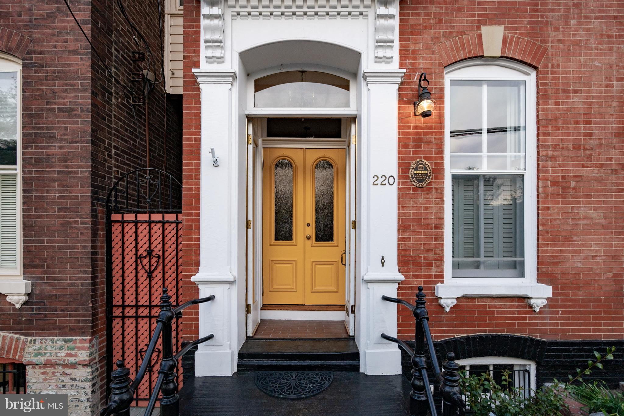 Built in 1885 in the Italianate Revival style and retaining its original floor plan, 220 S. Fairfax,  has not been on the market in 30 years.   South facing windows line one side of the house  and a vestibule, formal living and dining rooms, kitchen, half bath,  front and back stairways, and a three season glass enclosed porch make up the first floor.   The second floor features a small office, laundry room/half bath combination, library with built in's, and the primary bedroom and adjoining bath.  The third floor is home to two bedrooms and second full bath.  The unfinished basement is immediately available for storage or a workshop while considering other possibilities. A large flagstone and brick terraced back patio offers generous space for outdoor living and entertaining.  The front and back gardens are landscaped with perennials and a side alley makes for easy access.  Located in the desirable southeast quadrant two blocks off King and  two blocks from the Alexandria waterfront,  220 S. Fairfax is an urban dwellers dream and a history buff's fantasy.