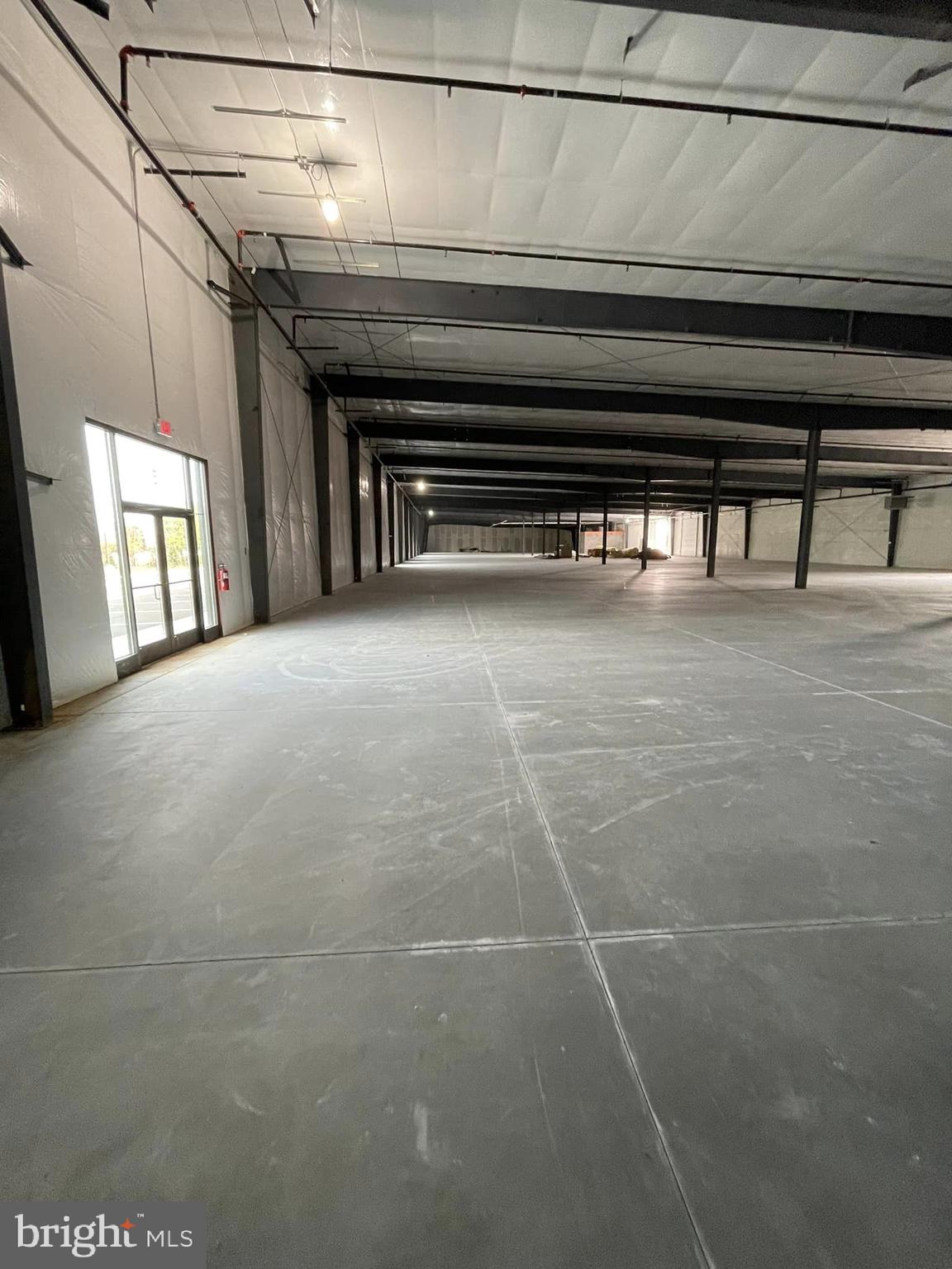 PRICE ESTIMATE for Cold Dark Shell - 331 Aviation Way is a Sprinklered Condominium Building with PRICE ESTIMATE for Cold Dark Shell - 331 Aviation Way is a Condominium Building with 55,002 SF.  
One Unit with 13,780 SF @ $14 + NNN ($3.20 PSF) Can Be Subdivided.
Restrooms are not installed as the owner is waiting to see where future tenant wants the location of it.
The Site totals 4.66 Acres and is Zoned M1 (Light Industrial) and located in the (AO) Airport Overlay Zone.  Located Across from Frederick Airport.