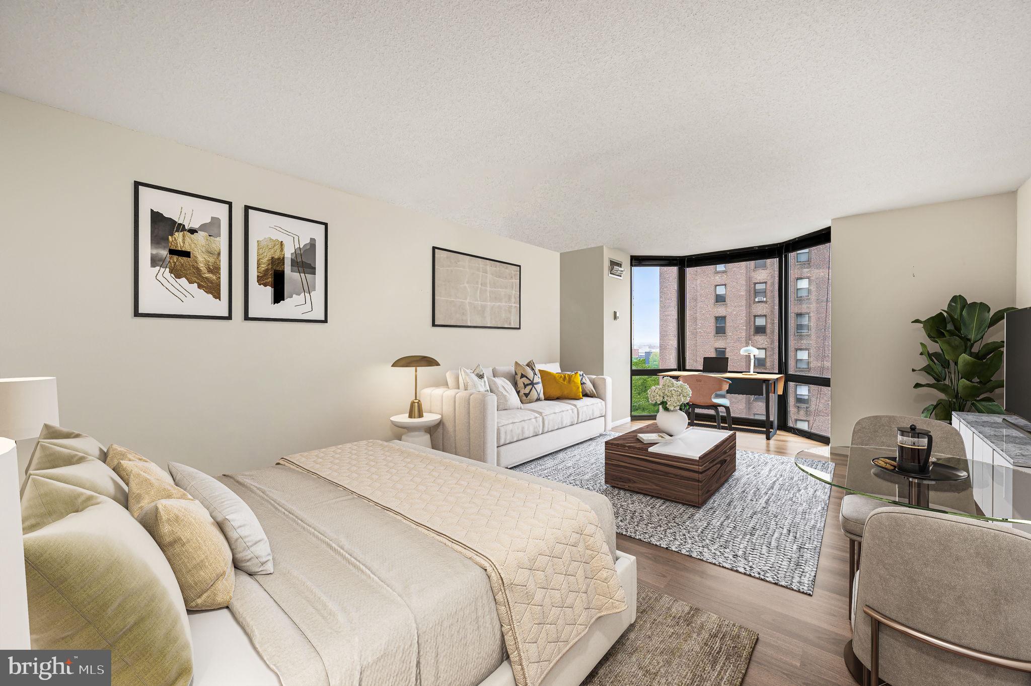 Sun-drenched studio at The Wanamaker House offering exceptional space and versatility. With desirable southern exposure, this bright and airy home is filled with natural light throughout the day. The spacious main living area features floor-to-ceiling bay windows with sweeping city views and easily accommodates separate living, dining, and work from home spaces. Storage is a standout, with generous closet space rarely found in a studio. The separate kitchen is spacious and thoughtfully laid out, featuring granite countertops, stainless steel appliances, tiled flooring, and a dishwasher. A well-appointed dressing area with an exterior vanity provides added convenience and privacy, while the updated bathroom features a granite-topped vanity and modern finishes. Residents of Wanamaker House enjoy a 24-hour door person, a fitness center with sauna, reading lounge, business center, and an entertaining space complete with a catering kitchen. The seasonal rooftop pool offers panoramic city views, perfect for relaxing.  A deeded parking space can be purchased for an additional fee.  The building is cat-friendly. Ideally located with easy access to 30th Street Station, Penn, Drexel, Wharton, and the Schuylkill River Trail, this home is just steps from Rittenhouse Square and surrounded by some of the city’s best restaurants, cafés, boutiques, and more.