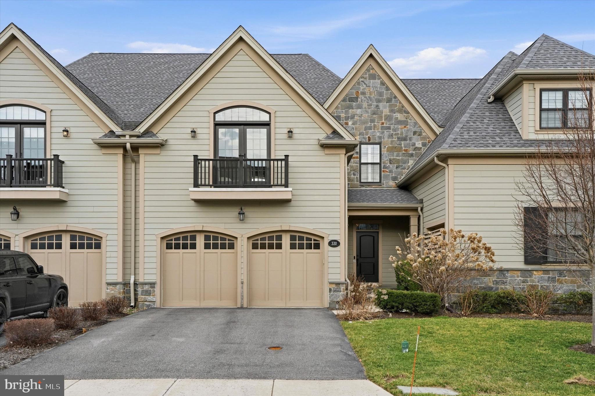 Welcome to 320 Whitemarsh Drive, located in The Reserve at Creekside, the area’s premier carriage home community. This beautiful Devon model offers 4 bedrooms, 3 full and 1 half bath over more than 3,700 square feet of thoughtfully designed living space across three levels, combining elegant finishes with an open, functional layout. The main level features a spacious great room with corner fireplace and sliding doors that open to a large deck, seamlessly connecting indoor and outdoor living. The great room flows into the gourmet kitchen and breakfast area, highlighted by an oversized center island, upgraded cabinetry, granite countertops, tile backsplash, stainless steel appliances, and a large walk-in pantry. A separate dining room provides the perfect setting for holiday gatherings or everyday entertaining. A conveniently located powder room and access to the oversized two-car garage complete the first floor. Upstairs, the primary suite offers a relaxing retreat with two walk-in closets and a spa-inspired bathroom featuring a dual vanity, a private water closet, and an oversized glass-enclosed shower. Two additional generously sized bedrooms, a hall bathroom, and a second-floor laundry room complete the level. The recently finished lower level expands the home’s living space with a large recreation area, bedroom, full bathroom, and abundant storage—ideal for guests, a home office, or additional living space. Residents of The Reserve at Creekside enjoy maintenance-free living and exceptional community amenities, including a 4,500-square-foot clubhouse with gathering space, kitchen, fitness center, and outdoor pool with flagstone patio. Ideally located in Whitemarsh Township, just minutes from Fort Washington and Wissahickon Parks, the shops and dining of Flourtown and Chestnut Hill, and with convenient access to Routes 309, 476, and the Pennsylvania Turnpike.