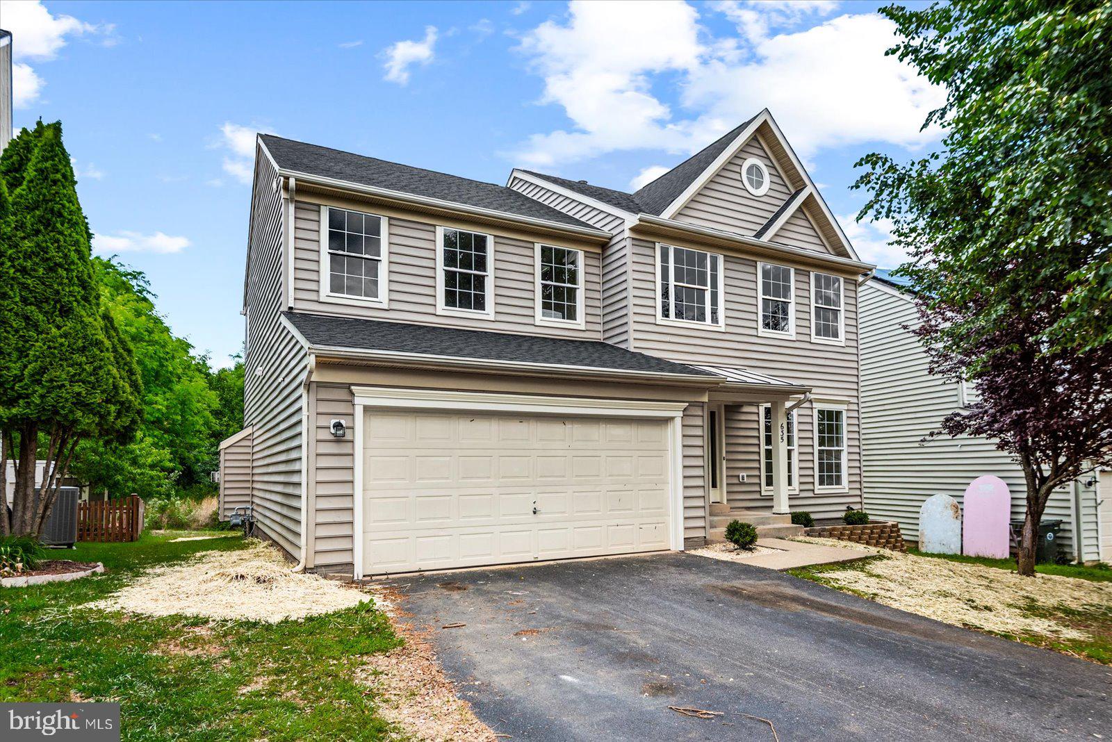 This beautifully updated colonial offers the perfect blend of modern finishes, functional living space, and timeless charm. From the moment you arrive, you’ll appreciate the inviting curb appeal, attached two-car garage, and spacious layout. Inside, the light-filled open floor plan features fresh paint, luxury flooring, recessed lighting, and a stunning kitchen complete with white cabinetry, quartz countertops, stainless steel appliances, wall ovens, and a large center island perfect for gathering. The kitchen opens seamlessly into the spacious den with a cozy fireplace, creating the ideal heart of the home. Upstairs, you’ll find four generously sized bedrooms, a beautifully remodeled hall bathroom, and an updated primary bathroom featuring stylish finishes and a gorgeous tiled walk-in shower. The fully finished basement adds even more versatile living space and features a common area, full bathroom, and two additional not-to-code bedrooms — ideal for guests, hobbies, office space, or multigenerational living needs. Located in the sought-after Lakeview of Culpeper community, where residents enjoy amenities including a community pool, clubhouse, playgrounds, walking trails, and scenic lake views throughout the neighborhood. Enjoy peaceful wooded views from the rear of the home while still being conveniently located near shopping, dining, commuter routes, and everyday conveniences. This move-in ready home truly offers the space, updates, and community features today’s buyers are looking for.