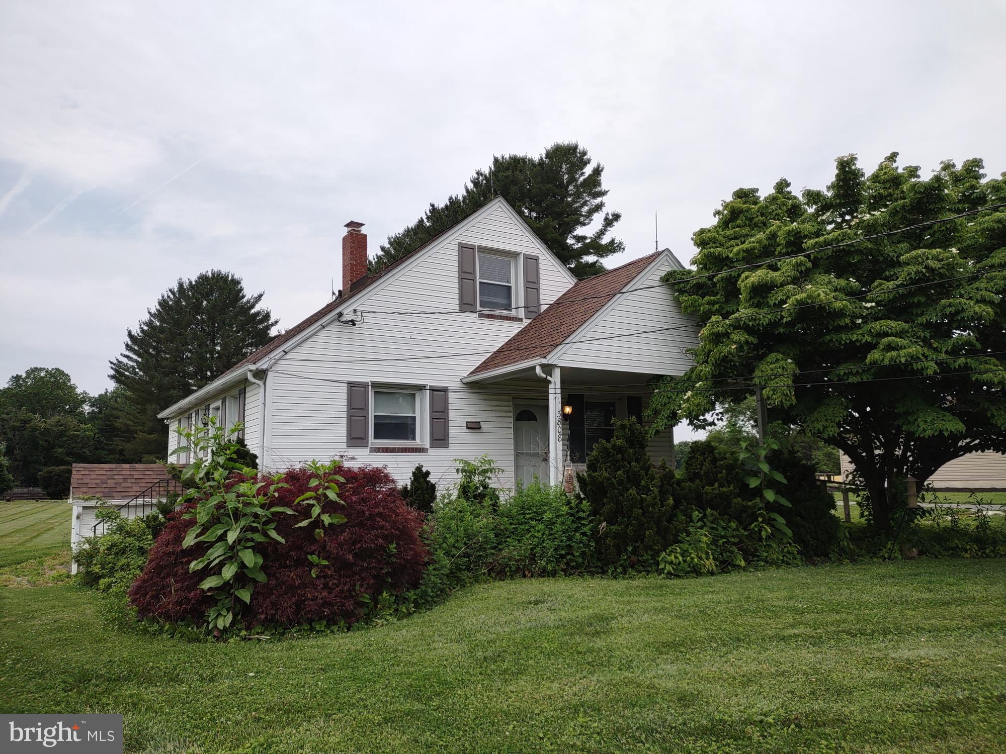 Cape Cod Home with a guest house and detached 1-car garage on a 1 acre Home Site, being sold in "as is" condition.  The main house has hardwood floors and LVP wood tone floors, granite counters in the kitchen, 2 bedrooms and a bathroom on the main level, and 2 bedrooms on the second level.  The oil-fired hotwater baseboard heating system is not functional. A water leak occurred in a baseboard unit in the front second level bedroom which resulted in water damage to the main level center wall and kitchen ceiling.  The guest house has a living room, kitchen, mudroom, bathroom and bedroom with a propane water heater and electric heat pump HVAC.  Termite damage is evident in the guest house kitchen floor.  The WDI Inspection Report from Lynn Pest Management for the main house, guest house, and det. garage is pending. See the MLS documents for detailed brochure, Health Dept. records, and Seller disclosures