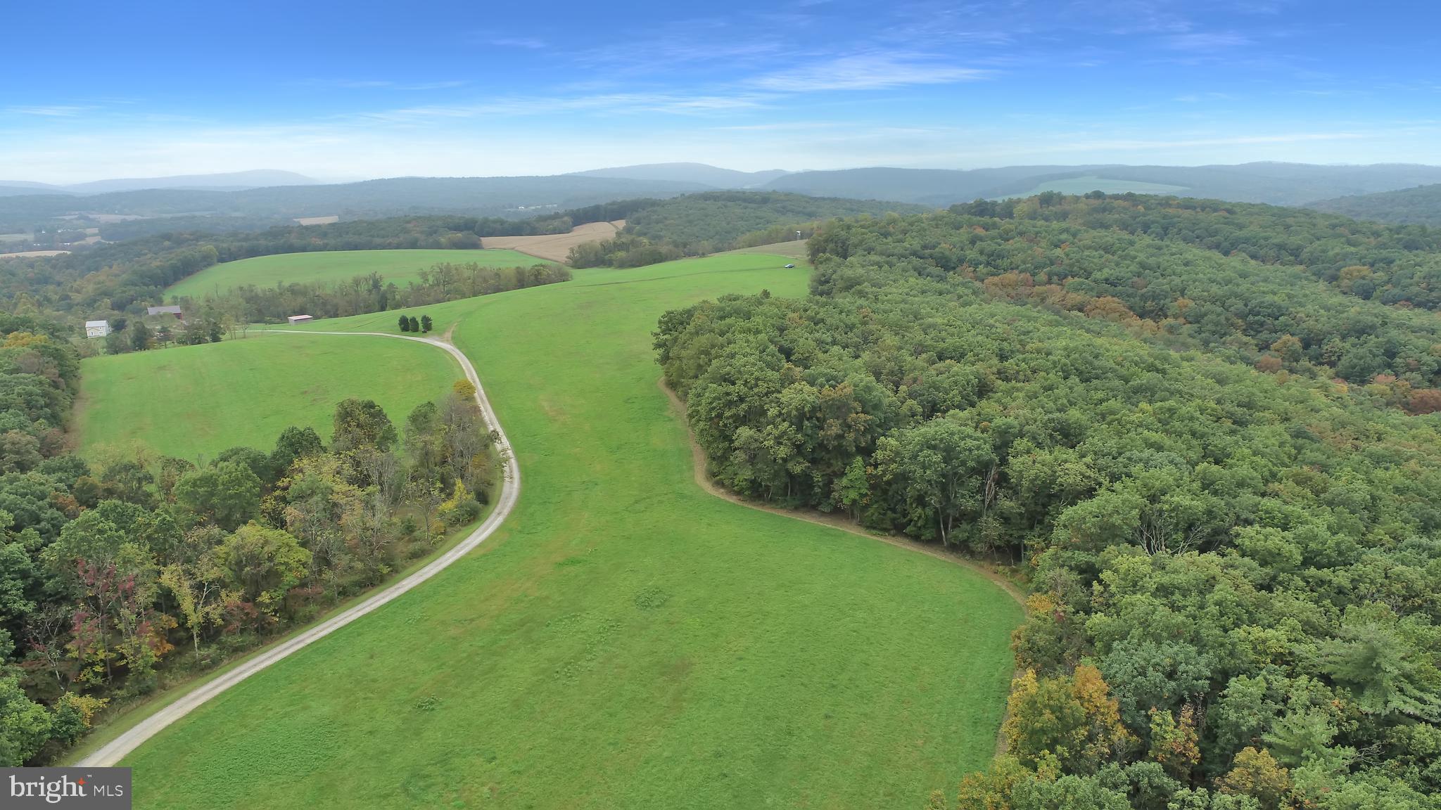 Two Woodlots, Greenwood Township Juniata County. Secluded 63.70 acres with perk and septic design for building dream home. Established riding and walking trails. Stream and Spring on site with no deed restrictions and use builder of buyers choice. Other financing Available.