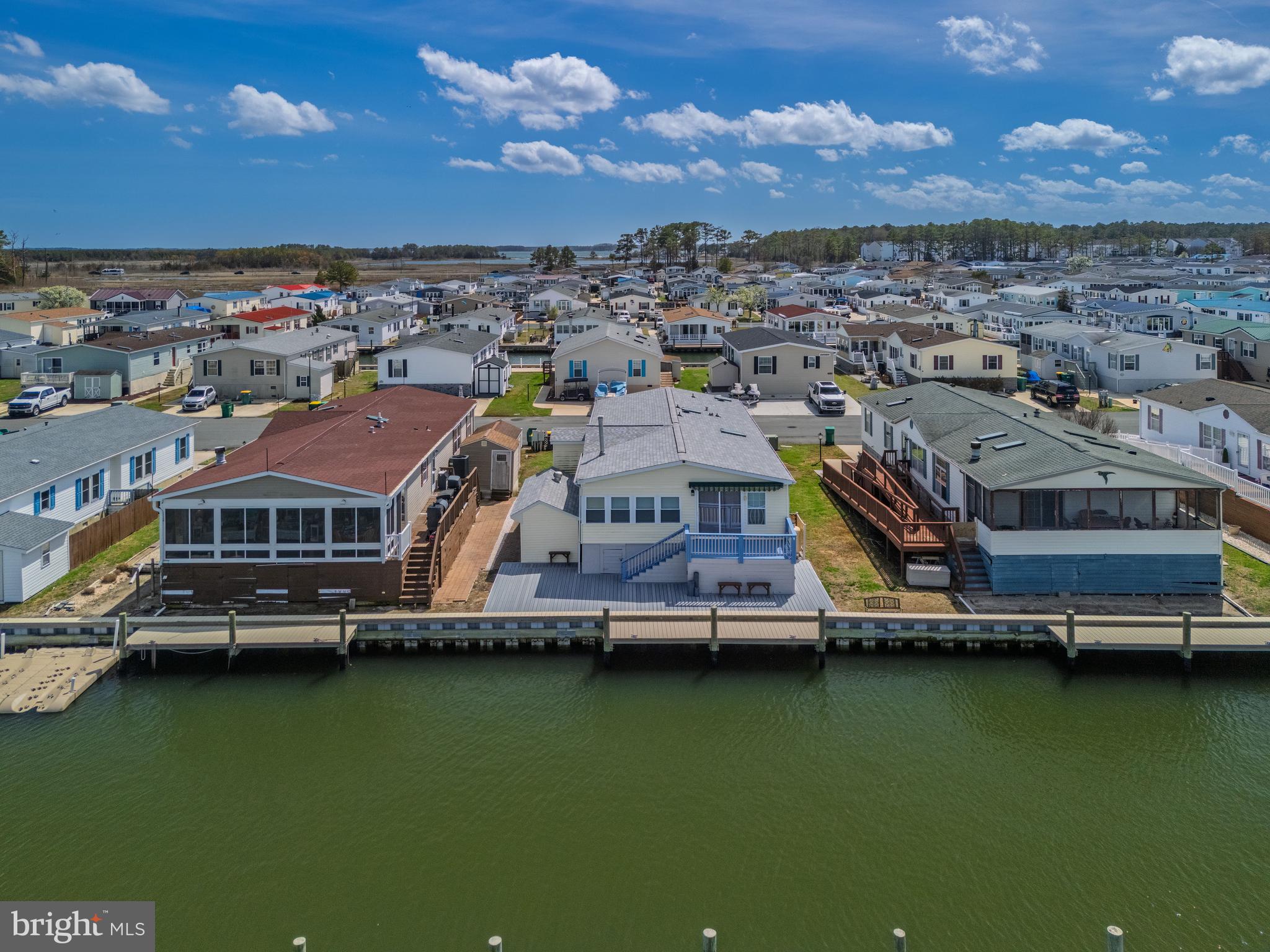 Welcome to your ultimate waterfront escape in the highly sought-after Mariners Cove community in Long Neck—where coastal living meets a true boater’s and fisherman’s dream.

Perfectly positioned along a canal with direct access to the Indian River Bay, this home offers your very own private dock just steps from your door—making early morning fishing trips, sunset cruises, and days on the water effortlessly part of your everyday lifestyle.

Inside, you’ll find a spacious and inviting open floor plan designed for comfort and easy entertaining. The bright living area flows seamlessly into the kitchen and dining space, while the sunroom provides the perfect spot to unwind and take in peaceful water views year-round.

Whether you're hosting after a day on the boat or simply enjoying a quiet coastal evening, this home offers the ideal balance of relaxation and functionality.

Located just minutes by boat or car to some of the area’s most popular waterfront destinations including Paradise Grill, and a short drive to Dewey Beach, Rehoboth Beach, and all of the dining, shopping, and entertainment the Delaware beaches have to offer—this is coastal living at its finest.

Whether you're looking for a full-time residence, weekend getaway, or investment opportunity, this is your chance to own a slice of waterfront paradise.