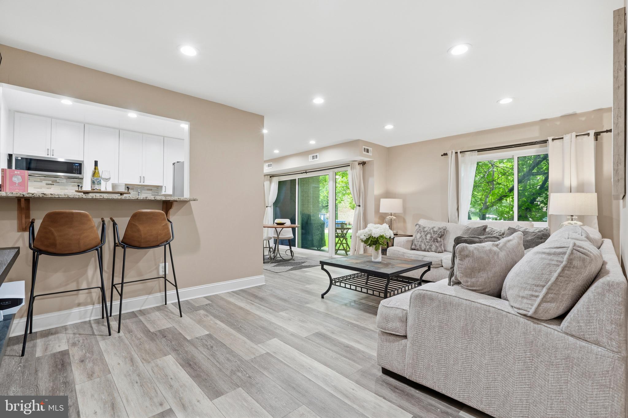 A private, ground-level retreat designed for effortless living! Perfectly positioned at 2907 Charing Cross Road (Unit 3) within the highly accessible Yorktowne Square subdivision, this beautifully renovated 1-bedroom, 1-bathroom condo offers 723 square feet of sophisticated, light-filled space. Step inside to find extensive premium upgrades, including modern recessed lighting throughout, newer flooring and clean baseboards in the open-concept living and dining areas, and plush new low-pile carpet in the spacious primary bedroom. 

The fully transformed kitchen is a chef’s delight, boasting stylish new cabinetry, pristine countertops, a contemporary mosaic tile backsplash, a deep sink with a modern faucet, and an above-range microwave. The full bathroom has been equally reimagined with a chic new vanity and elegant custom tiling. Flooded with natural light from large patio sliding doors, the living area opens directly to a private back entrance leading out to an expansive, park-like common area—perfect for outdoor gatherings, picnics, or relaxing on the lawn. Unbeatable building convenience defines this unit: your extra storage locker and the community laundry facilities are located just steps away on the exact same level, right next to your front door.

Enjoy a stress-free lifestyle with a monthly condo fee that covers ALL utilities (electricity, gas, water, sewer, and trash) and grants access to premier community amenities, including a swimming pool, picnic spots, and a tot lot. This commuter’s dream is minutes from the Dunn Loring Metro, Tysons, Inova Fairfax Hospital, and the vibrant dining and shopping of the Mosaic District. The kind of space that simply feels good to come home to.