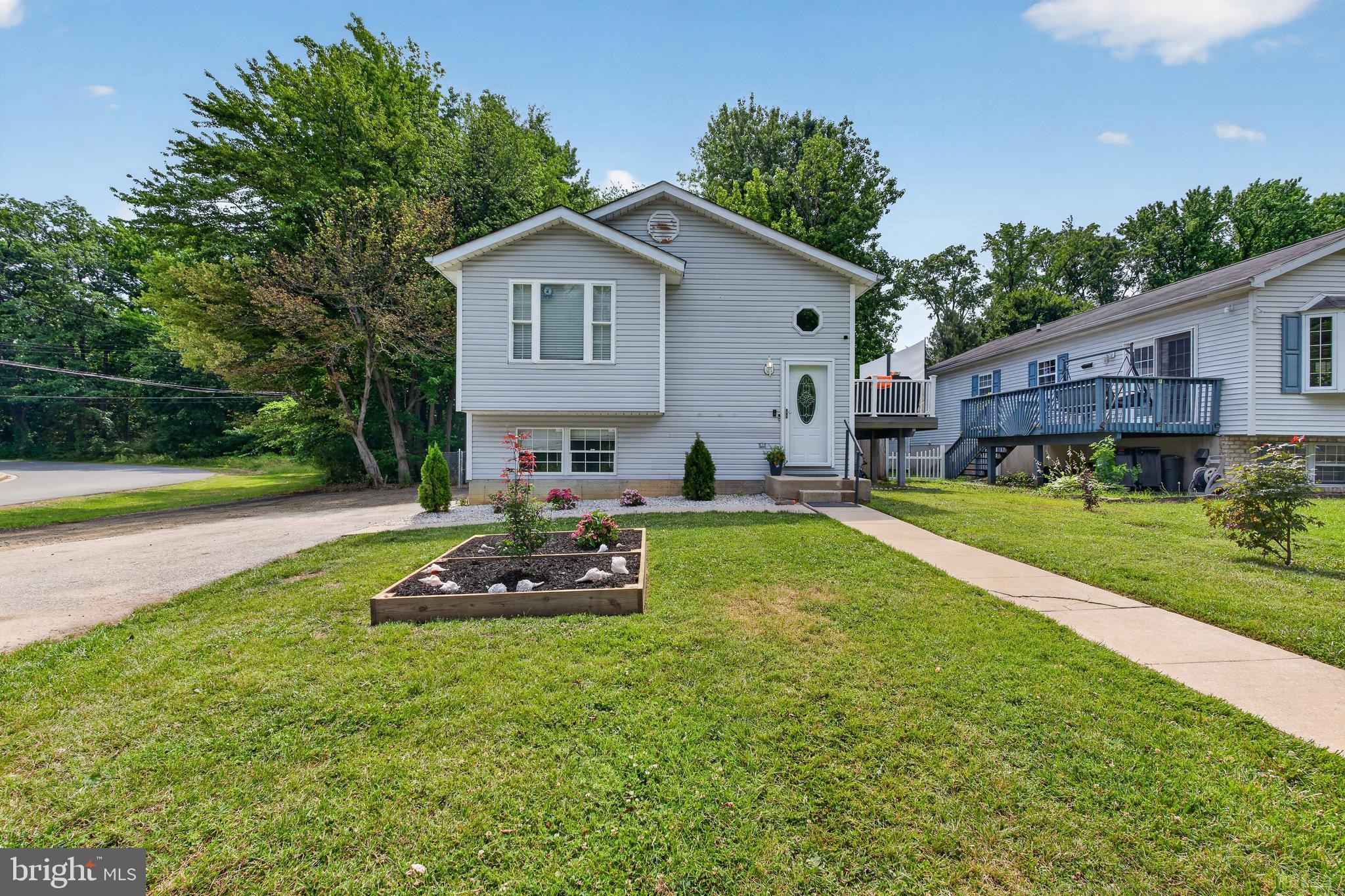 Welcome home to this fabulous 4-bedroom, 2 full bath, split foyer located on a premium corner lot on a non-through street, in the desirable Edgemere/Sparrows Point area of Baltimore County. Offering over 1900 sq. ft. of finished living space, this home has been thoughtfully updated throughout with modern fixtures and finishes.  While the main level features a top-of-the-line kitchen remodel in 2025 with crisp white cabinets, stainless appliances, new countertops, new flooring and an island that is to die for, it also features, stylish lighting and ceiling fans, a living room off of the kitchen, 3 spacious bedrooms with recessed lighting and a renovated full bathroom! The lower level was completely improved in 2023 adding a large 4th bedroom with a walk-in closet, a second full bathroom, laundry/utility room, and a huge versatile open space that can be utilized as a rec room, exercise room, additional living room, etc. The possibilities are endless and only limited by your imagination.  The exterior of this home is just as impressive as the interior with a deck off of the living room, a fully fenced rear yard, a large shed with electric, off-street parking and a 50-amp RV hookup!  This home is so easy to move in to as all of the important improvements have been completed including a new AC unit 2026, fresh paint 2026, roof 2021, expanded driveway 2026, back yard drain 2024, new sump pump 2024, and electric added to the back yard/shed in 2025.