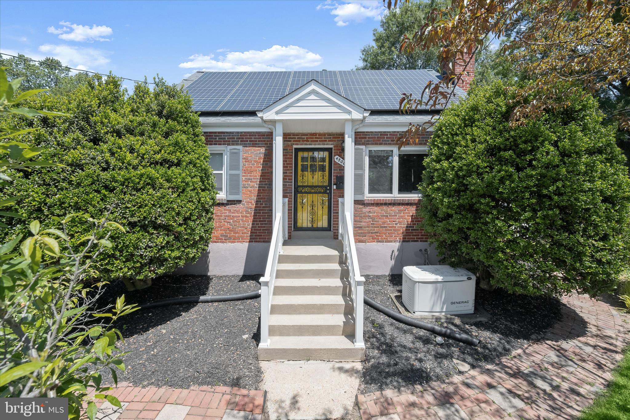 Nestled on more than a quarter acre in Beltsville's sought-after Chestnut Hills community, this classic brick Cape Cod combines timeless character with thoughtful updates throughout and offers three finished levels of comfortable living space. Hardwood flooring extends across the main level, where a welcoming living room sets the tone with crown molding, a cozy fireplace, and a triple casement picture window that fills the space with natural light. Just beyond, the updated eat-in kitchen features granite countertops, a tile backsplash, and stainless steel appliances, including a gas range. A sliding glass door opens to the screened porch, complete with a ceiling fan and easy access to the backyard, creating an ideal setting for outdoor dining and relaxation. The main level also includes a spacious primary bedroom with a walk-in closet and private en-suite bath, along with a second full bath showcasing classic black-and-white tile. Upstairs, two additional bedrooms provide comfortable accommodations with the charm and character expected in a Cape Cod design. The finished lower level expands the home's versatility with a recreation room featuring walkout stairs to the backyard, a bonus room well suited for a home office, exercise space, or hobby room, and a laundry room offering additional storage and convenience.
Outside, mature landscaping, attractive brick walkways, and garden beds enhance the property's curb appeal. The spacious backyard is fully fenced and includes a patio, storage shed, and plenty of room to enjoy outdoor activities. Recent improvements add peace of mind and efficiency, including solar panels, an updated roof, water heater, and backup generator. Conveniently located near local schools and the library, the home also enjoys easy access to shopping, dining, and recreation. Nearby destinations include Costco, Ikea, MOM's Organic Market, Calverton Shopping Center, College Park Market Place, Beltsville Neighborhood Park, Beltsville Community Center, and Vansville Recreation Center. Commuters will appreciate quick connections to Route 1, I-95, the ICC, and the Capital Beltway, providing convenient travel to Washington, D.C., Baltimore, and surrounding employment centers.