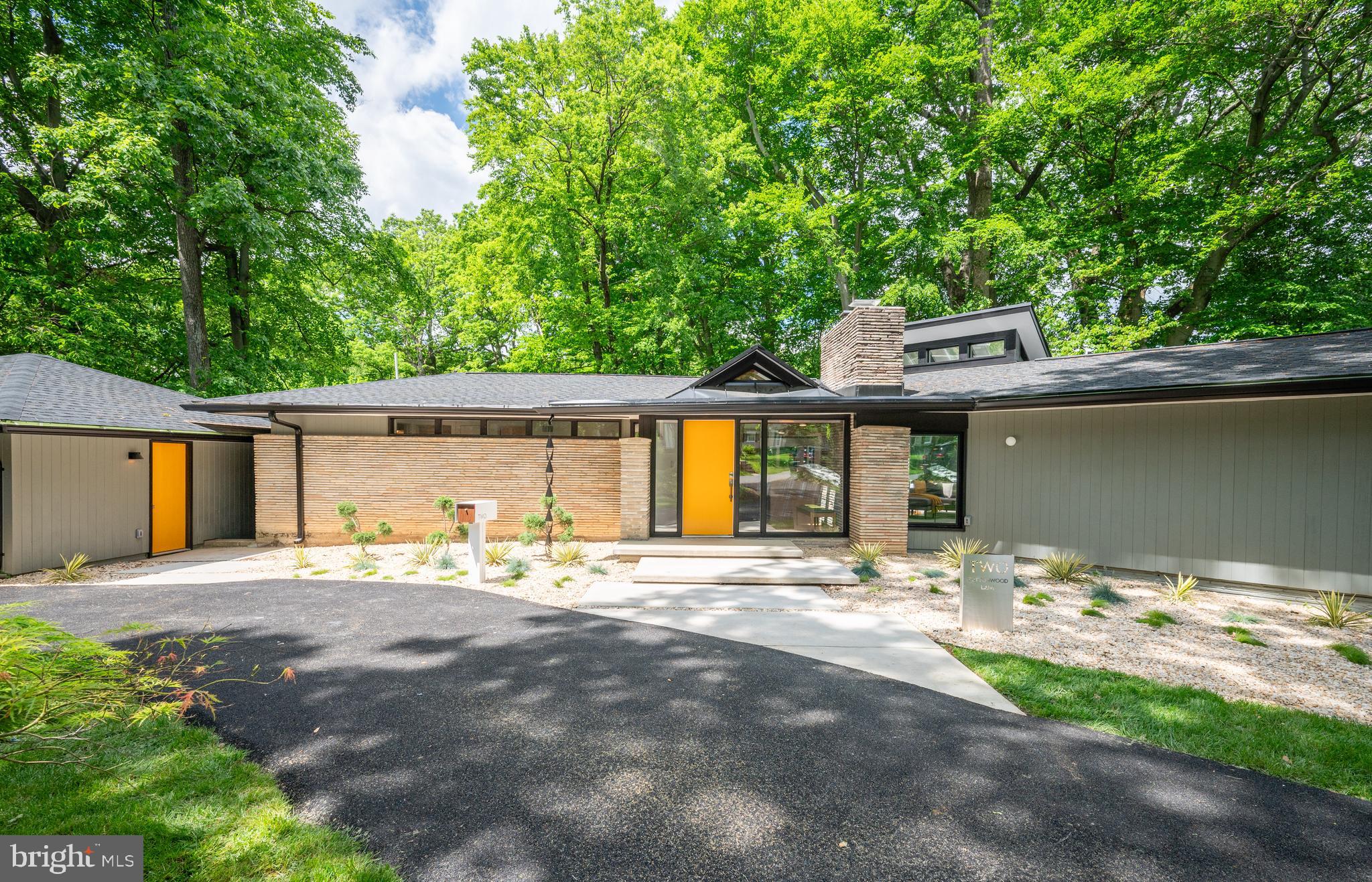 Open houses cancelled, property is under contract

.  A fully redeveloped Mid Century Modern dream in the coveted Tulip Hill neighborhood of Bethesda. A truly one-of-a-kind home, this 5 BR / 4 BA  home with 2 Car Garage was meticulously redesigned and remodeled top to bottom by MM Design Co. Beautifully positioned on more than one-half acre, the property has striking exterior elevations as you pull through the repaved governor’s driveway. Inside the beautiful foyer, you’ll find the original wood accent drop ceiling refurbished by hand. Beautiful Red Oak Hardwood Floors runs throughout the entire main level. Custom Stone Wrapped wood burning fireplace in the sun drenched open concept living room with floor to ceiling windows and skylights. The Vaulted Chef’s kitchen includes Two-Toned Wood Stained & Black Mid Century Modern Slab Front Cabinetry, 36” Dacor Professional Gas Range and Stainless Steel Appliances, a Massive 12 ft Center Island, Quartz Countertops, lots Full Height Pantry Cabinets, Fireclay Chaine Homme Backsplash, and MCM Globe Pendants Lights. On one side of open conceptis a formal dining space with Herman Miller Saucer Bubble fixture, and on the other side is a bonus sitting area or additional breakfast dining area. Off the main living space you can walk out of a 12 ft Bi-Folding Glass Door system onto a large new Trex composite deck that’s perfect for entertaining and grilling. On the main level is the Primary Suite with Walk In Closet and gorgeous large Primary Ensuite Bathroom with Terrazzo Double Vessel Sinks, Quartz Countertops, and Massive Double Shower & Custom Glass Tiling. Also on the main level is two more bedrooms as well as a Hall Bath including Floating Vanity with Tub/Shower Combo with beautiful MCM tiling. Downstairs features over 1800 sqft of finished living space including 2 massive bedrooms and 2 bathrooms, large family room with wet bar and laundry room. 1 of the Bedrooms serves as the perfect guest suite with ensuite bathroom that includes custom floating double vanity, terrazzo tile, and stunning walk-in rainfall shower. New Recessed Lighting, Electrical, and Plumbing Throughout the entire home. Outside there has been extensive landscaping and sod installed. New Windows. New HardiPanel Siding. Modern Baseboard and Trim. New Interior Slab Doors and Hardware. New Architectural Shingle Roof. New Garage Doors. New Gutters. Repaved Asphalt Driveway. New Exterior Lighting. New Custom Stand-up Address Sign, DeusModern Mailbox, and much more. Incredibly convenient location with quick commute to Bethesda, Downtown DC, Glen Echo Park, C&O Canel Trail, Potomac River, Northern Virginia, DCA/IAD airports, and 270 corridor. Public Schools: Woodacres Elementary, Pyle Middle, Walt Whitman H.S.

Don’t miss this chance to own and truly one-of-kind mid century modern showpiece home. Expected on market Thursday May 16.