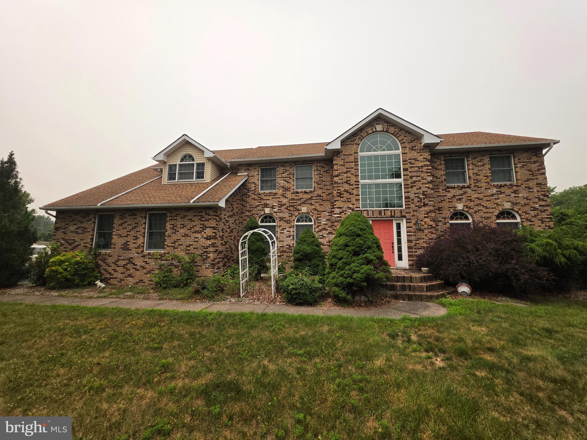 Welcome home to this exceptional 5,115-square-foot detached Colonial nestled on a premium 2.05-acre lot in the highly desirable Clearfield Crossing neighborhood of Nazareth, PA. The main residence boasts a spacious 3,720-square-foot layout featuring 3 generous bedrooms, 2.5 bathrooms, an attached 2-car garage, and a cozy fireplace in the inviting living room. Adding incredible value and flexibility to this estate is the fully finished 1,395-square-foot below-grade in-law quarters. This separate living area comes complete with its own 2 bedrooms, 1 full bathroom, and a fully equipped second kitchen, making it ideal for multi-generational families or long-term guests. Outside, the expansive and scenic yard serves as your own private oasis, featuring a refreshing above-ground pool perfect for summer entertainment. This rare property offers the perfect blend of privacy, space, and functionality in a top-rated school district.
