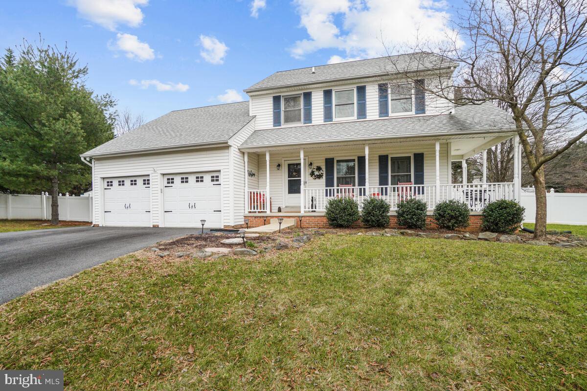 Welcome to this exceptionally maintained home! Situated on just a little less than half an acre set back on a cul-de-sac, this home has several updates and is ready to move right in.  A lovely covered wrap around front porch greets you as you enter keeping you out of any inclement weather all vinyl railing is new. Boasting hardwood flooring throughout the main level, offering a large open formal dining and sitting room area to the right as you enter.  Straight ahead you'll pass the newly updated half bath as you enter the  Kitchen offering  new fingerprint resistant s/s whirlpool appliances & island overlooking the step down family room.  Exit from the Kitchen to your private serene backyard oasis offering an extensively hardscaped  patio, gazebo perfect for relaxing outside, all enclosed by your vinyl privacy fence, a lovely gravel firepit area with posts and lights, perfect for year round entertaining.  The upper level offers 3 nice sized bedrooms, hall bath with new toilet, the primary offering an ensuite bathroom; recently renovated.  Downstairs you will find plenty of storage, a large rec room and separate laundry and utility area.  A 2 Car oversized garage offers more storage along with the extended newly paved driveway (2021) providing plenty of off street parking accompanied with plenty of street parking for your guests.  The sellers have lovingly maintained this home some of the notable updates include: A brand new Roof in 2018, new hardware, faucet and backsplash in the Kitchen in 2018 , All new stainless steel appliances in 2019 & new Whirlpool washer and dryer. New Kitchen island in 2021. Updated hall bath in 2020. New wifi enabled Rheem water heater in 2020. New Anderson french doors to backyard (2024) New light fixtures, new iron rails and balusters on the stairs(2024).  See the FULL list in the disclosures.  Excellent location! Easy access to Rt. 70, Middletown Middle & High Schools. Less than 6 miles to downtown Middletown shopping & restaurants, 15 miles to downtown Frederick!