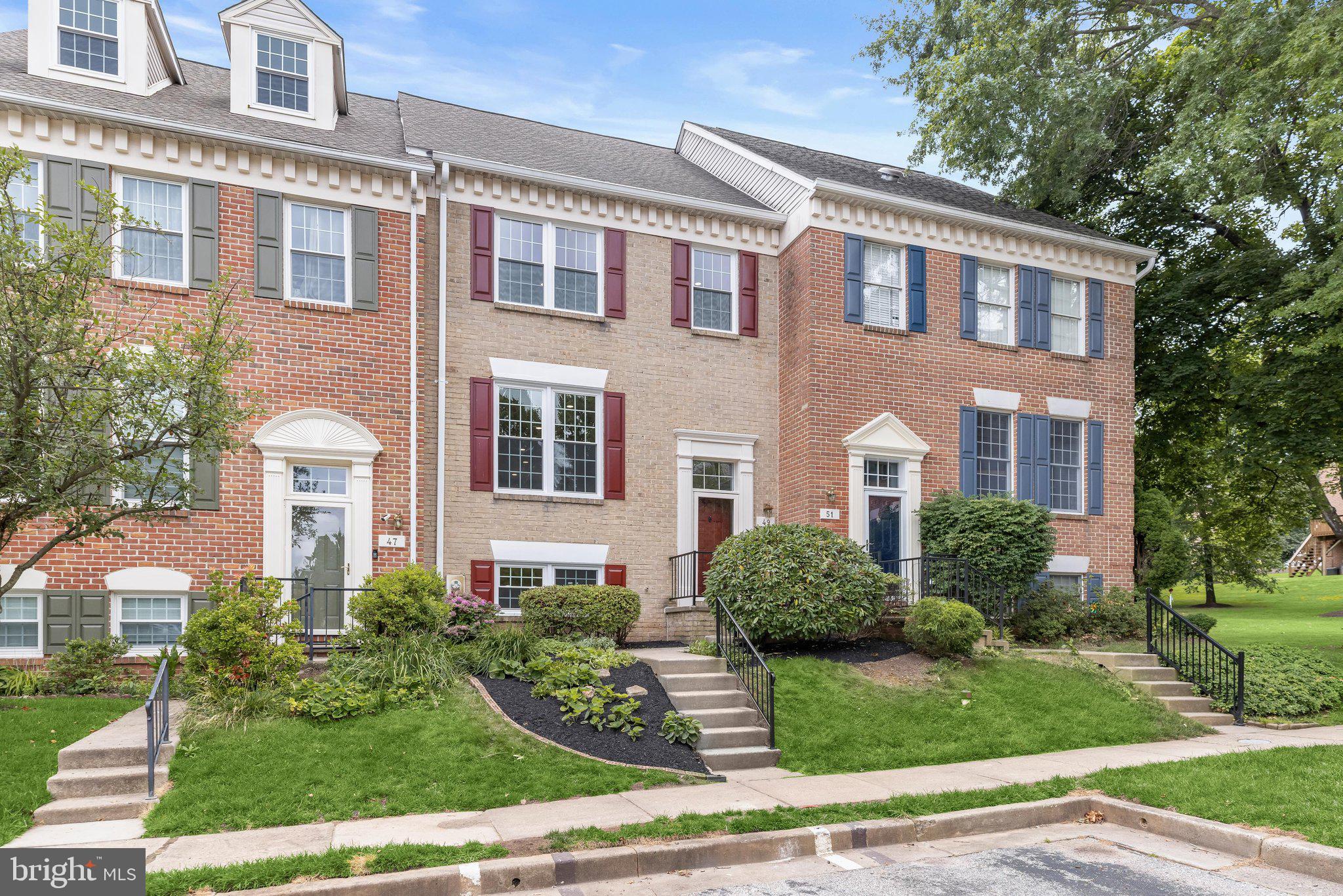 Introducing this exquisite renovated townhome in the sought-after Chapelgate neighborhood of Mays Chapel, offering four bedrooms with three and a half bathrooms across three finished levels of stylish living space. Completely remodeled from top to bottom, this brand-new move-in-ready home showcases thoughtful upgrades, a modern neutral color palette, abundant natural light, and refinished hardwood floors throughout the main and upper levels. The open-concept main level is designed for comfortable everyday living and entertaining, featuring a spacious dining area and an inviting living room centered around a cozy wood-burning fireplace. Sliding glass doors lead to a deck overlooking the peaceful backyard and wooded backdrop. The stunning kitchen is equipped with stainless steel appliances, quartz countertops with a breakfast bar, a tile backsplash, soft-close shaker cabinetry, and a pantry for ample storage. A convenient half bathroom completes the main level. Upstairs, the impressive primary suite boasts a soaring vaulted ceiling, a walk-in closet, and a luxurious en-suite bathroom with a dual-sink vanity and a walk-in shower with a built-in bench. Two additional bedrooms and a beautifully updated hall bathroom complete the upper level. Downstairs, the finished lower level provides exceptional flexibility with a fourth bedroom, a third full bathroom and spacious recreation room featuring a wet bar and sliding glass doors that offer direct access to the backyard and patio.