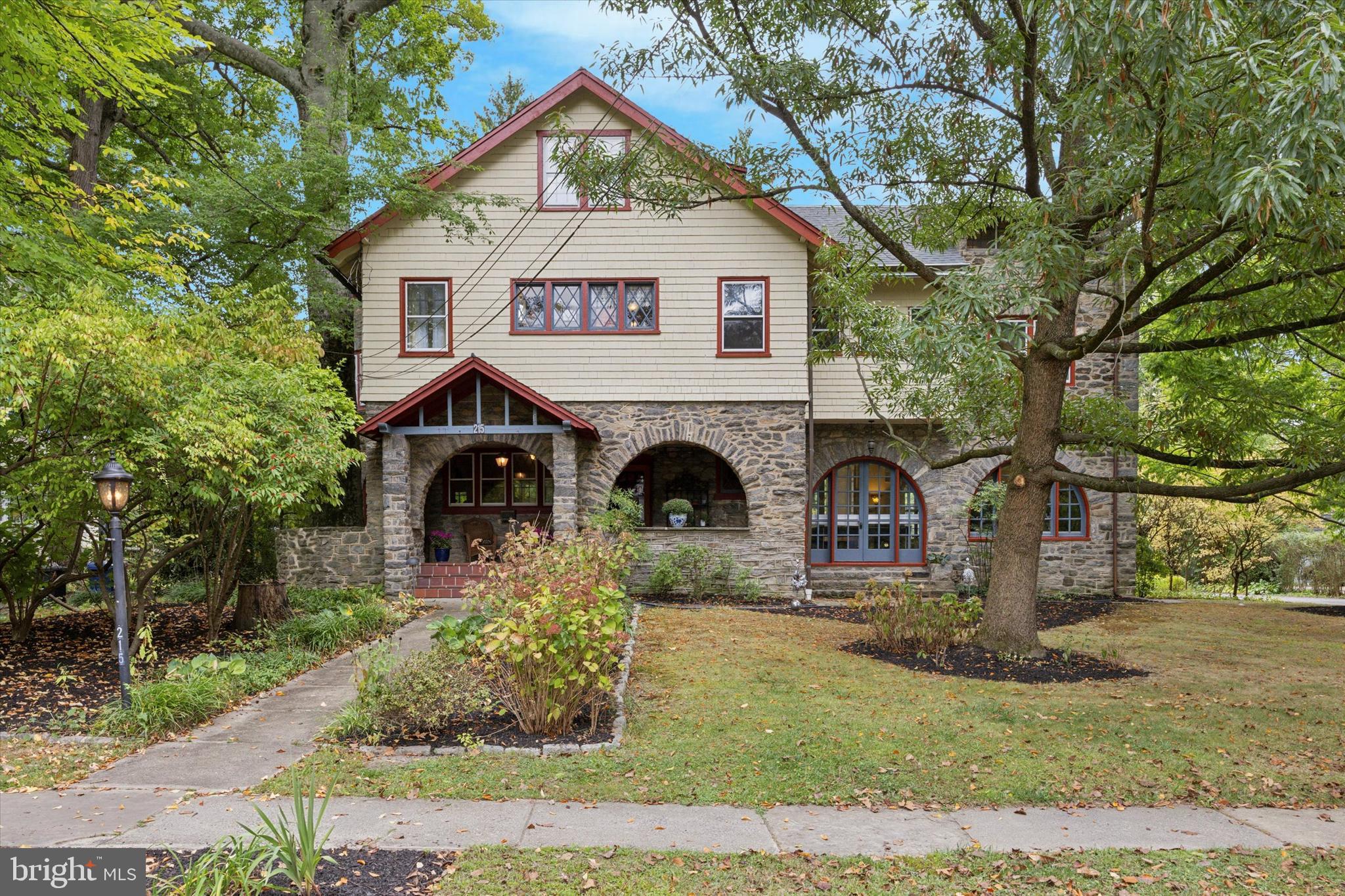 This home is enchanting! It was crafted and constructed by the esteemed writer, Grace Livingston Hill. This unique and diverse home perfectly captures the essence of the turn of the century with its magnificent Arts and Crafts elements, graceful archways, and charming turret. While incorporating modern updates, the home has preserved its original charm and character. 
Updates include; new furnace in 2012; new hot water heater 2017; basement waterproofing with French drains, two sump pumps and wall treatments in 2016-2020; refinished hardwood floors on second floor 2018; balcony resurfaced in 2018; new Samsung stove, refrigerator, dishwasher and microwave in kitchen 2022; stone pointing in 2022; band new fence enclosing backyard in 2022; remodeled second floor powder room 2022 and remodeled primary ensuite bathroom in 2023, both with underfloor heating; new roofs replaced from 2018-2024. 
Inside, you'll discover many built-in features, cozy fireplaces, stunning terracotta tiling, and elegant hardwood flooring. French doors guide you to a delightful elevated patio, where you can indulge in the awe-inspiring views of the expansive backyard and garden, along with a separate three-car garage. From the inviting covered front porch to the turret that offers panoramic views of the surrounding trees and rooftops, it is truly one of a kind.