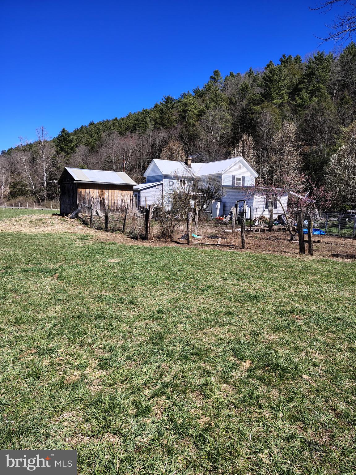 Nestled in the scenic mountains of Sugar Grove, this 4-bedroom, 2-bath home offers the perfect blend of country living and practical functionality. The property features multiple outbuildings, providing ample space for equipment storage, workshops, hobbies, or agricultural use. A small garden is already established and growing, offering a great start for anyone who enjoys gardening. Whether you’re looking for a full-time residence or a weekend retreat, this property offers plenty of flexibility. Enjoy the peace and privacy of rural West Virginia while still having all the essentials for comfortable living.
