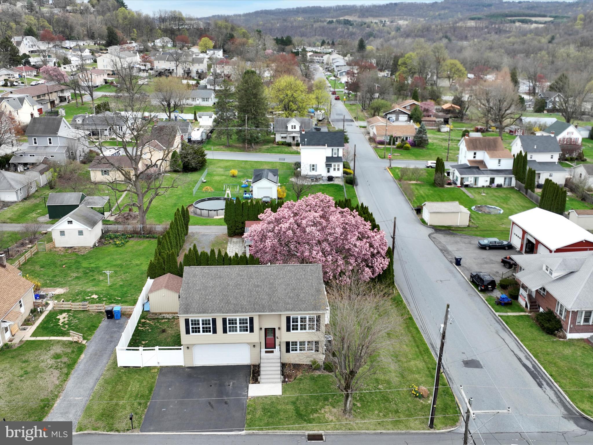 The pink tree marks the spot! This impeccably maintained bi-level home blends style, comfort, and convenience in a peaceful residential setting with beautiful views. Ideally located just minutes from parks, restaurants, shopping, the new Giant grocery store, and Route 145, this property offers the perfect balance between tranquility and accessibility.

The home features 3 generously sized bedrooms and 2.5 bathrooms, with an open-concept floor plan designed for modern living. Thoughtfully upgraded, the home includes luxury vinyl plank flooring throughout the main living areas, refinished stairs, and a custom-stained deck. Additional enhancements include a brand new $10,000 vinyl fence, garden shed, raised garden beds, updated landscaping, and upgraded lighting with modern energy-efficient LED fixtures.

Smart home features such as a Ring doorbell and smart thermostat offer added comfort and security. The kitchen is accented by a tile backsplash, while upgraded trim, custom closet systems, and pre-wired audio jacks for surround sound elevate the home’s function and style. The interior has been professionally repainted in a contemporary, neutral palette to suit a variety of tastes.

An oversized two-car garage offers ample storage and includes a finished interior, automatic opener, and exterior keypad access. With a great yard and well-appointed finishes throughout, this home is move-in ready and a true standout in today’s market. Book your showing anytime!