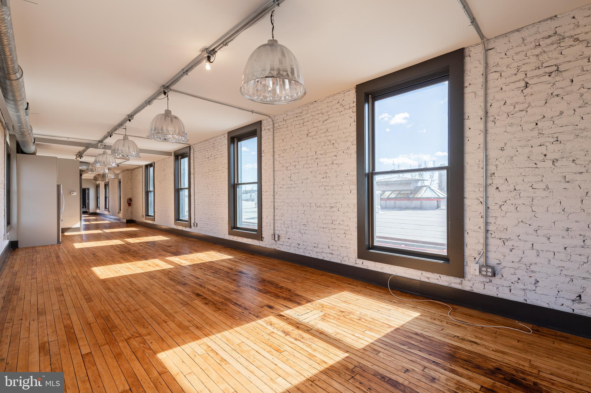 CONTEMPORARY COMMERCIAL SPACE IN PRIME CANTON LOCATION! Triple net lease. Approximately 1400 sq. ft. of commercial space w/ hardwood floors, exposed ductwork, tall ceilings, exposed brick, full kitchen w/ granite counters & ss appliances, & full bath. Located on highly traveled Conkling St. w/ good foot traffic. Ready for immediate occupancy.  Triple Net Lease