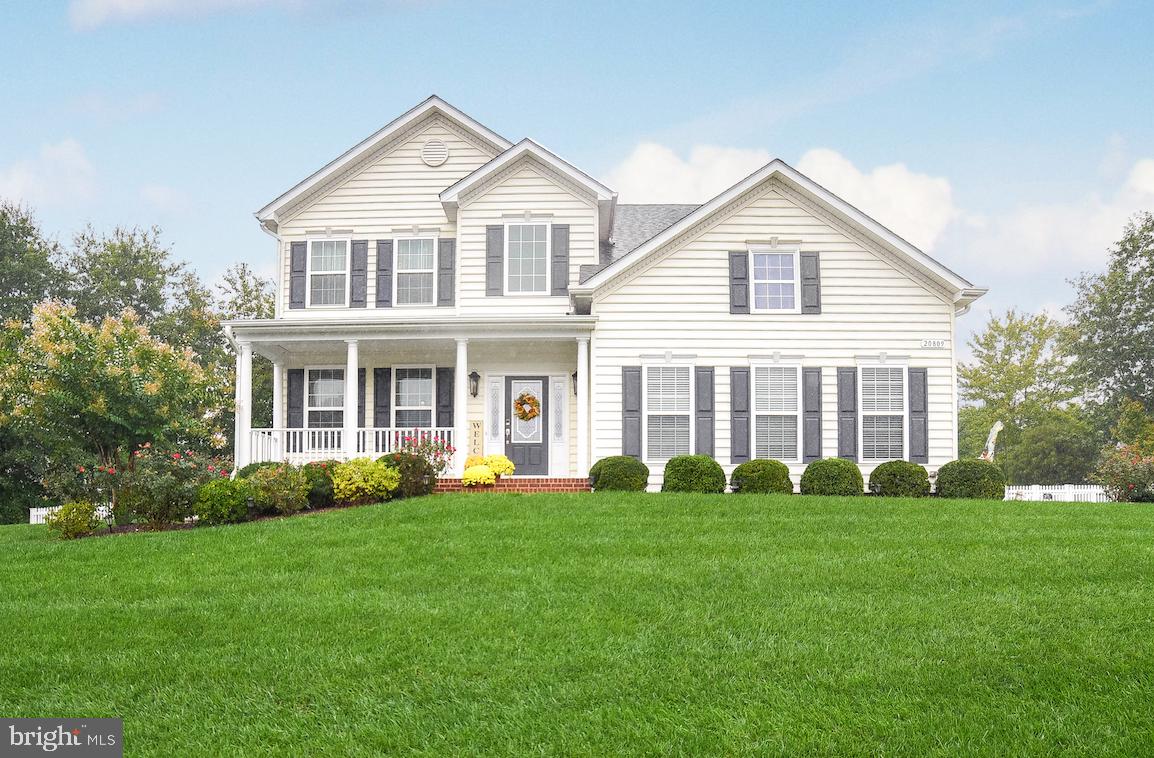 This exceptional home will exceed your expectations! Situated on one of the largest lots in the neighborhood (.48 acre!), your new home  offers an upgraded kitchen, spacious family room w/gas fireplace, and formal dining room, plus laundry room & 1/2 bath on the main level. Attractive kitchen has granite countertops, island, stainless appliances inc double ovens & microwave, ceramic tile flooring, and table space. Lovely hardwood in FR & DR! Roomy owner's suite has separate office/sitting room, and large walk-in closet; deluxe bath w/separate vanities, corner soaking tub, and tiled shower. Hardwood flooring throughout the second floor--gorgeous! Finished basement provides huge rec room, third full bath, and fourth bedroom. You will enjoy crisp fall days in your big back yard, fully fenced, with a new composite deck and cozy firepit on the patio! Extras include ceiling fans, lawn sprinkler system, pretty landscaping with lighting, storage shed, heat pump with natural gas backup, nat gas HW. Two-car garage with plenty of driveway parking. Nice tot lot/playground in the neighborhood; quick commute to NAS PAX!