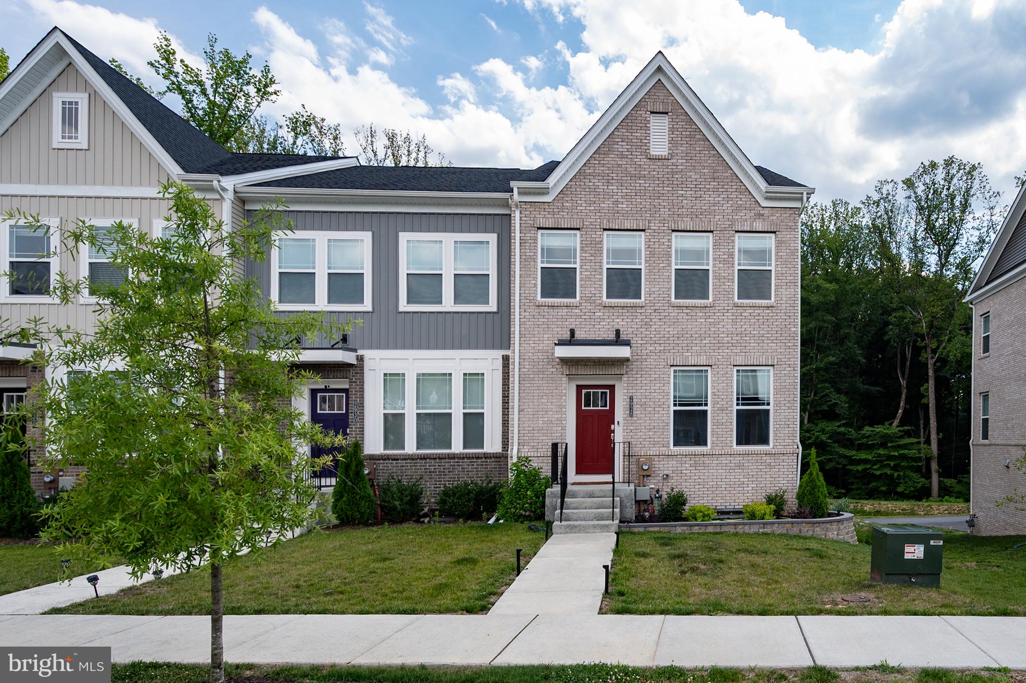 Better than new and backing to mature trees for added privacy, this impeccably maintained 3-level townhome combines designer finishes, thoughtful upgrades, and custom details in a home that’s truly move-in ready.

Thoughtfully designed with spacious, light-filled living areas and today’s sought-after open-concept floor plan, this home offers the perfect blend of style, comfort, and functionality. The main level showcases wide-plank flooring, upgraded cabinetry, quartz countertops, a stunning white subway tile backsplash, a stainless steel range hood, designer pendant lighting, and a custom Beverage Station that creates the perfect space to start your day, entertain guests, or unwind at the end of the evening. Designer-selected finishes continue throughout the home, creating a polished, cohesive look from top to bottom.

Step outside to your expansive composite deck overlooking the peaceful wooded backdrop—an ideal setting for morning coffee, outdoor dining, or relaxing evenings. The professionally landscaped yard, complete with elegant brick-edged flower beds, enhances the home’s exceptional curb appeal and creates a warm, welcoming first impression.

Additional highlights include a rear-entry two-car garage plus a driveway that accommodates two additional vehicles, providing parking for up to four cars. Every detail reflects pride of ownership, and after just two years, this home remains in exceptional condition and shows like a designer model home.

Located in the sought-after Bryans Village community, you’ll enjoy convenient access to commuter routes, shopping, dining, parks, and everyday conveniences while coming home to a peaceful neighborhood setting.

If you’ve been considering new construction, this home offers all the upgrades, none of the wait, and is ready for you to move in and enjoy from day one.