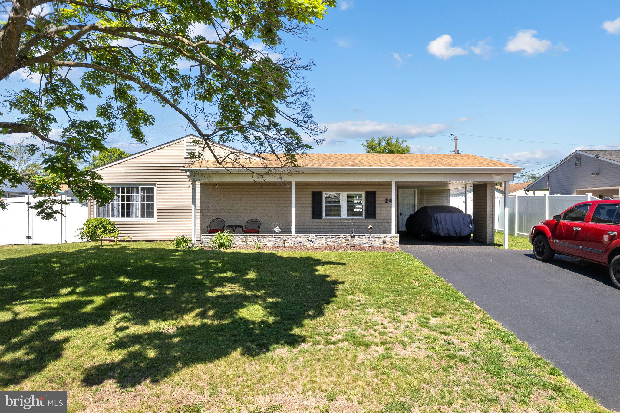 Welcome to 24 Garden Lane, a total knockout in Levittown’s sought-after Greenwood section. This isn't your average rancher—it’s been meticulously updated and maintained with a level of care you can feel the moment you walk through the door.

The first thing you’ll notice is the stunning, wide-plank flooring that flows through an open layout, but the real showstopper is the massive gourmet chef’s kitchen. With sleek quartz countertops, updated appliances, and a huge center island, it’s the kind of space that naturally becomes the heart of the home. Down the hall, you’ll find three bright, airy bedrooms and a crisp, modern full bath.

What really sets this property apart is the expansive, full-size sunroom. It’s a rare find for this model and offers that essential extra living space—perfect for a cozy media room, a home office, or a secondary lounge.

Sitting on a generous 7,000 sqft lot, the outdoor setup is just as impressive, featuring a covered carport and a driveway with room for 3+ cars. Toss in the central AC for those humid summer days, and you have a move-in-ready gem that’s truly priced to sell. This one won’t sit long.