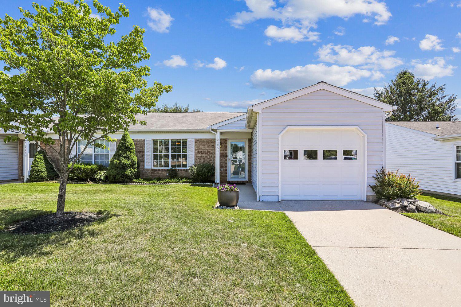 Beautifully remodeled 2-bedroom, 2 full-bath home located in Crestwood Village, a desirable 55+ active adult community.

A major professional interior renovation, completed in 2007, included the award winning addition of a sunroom with skylight; an entirely newly constructed open-concept kitchen, dining and living space with an open floor plan featuring euro-style cabinetry (updated in 2022), granite countertops, a center island with seating and storage, and stainless steel appliances; updates to all electric and plumbing including new outlets, ceiling and pendant lighting and new bathroom sinks and toilets; installation of all new flooring throughout; updates to closets; and fresh paint throughout the home.

Additional thoughtful upgrades provide exceptional comfort, low maintenance and peace of mind, ensuring your relaxed retirement lifestyle. These include a state-of-the-art HVAC system located in the attic with electronic air purification installed in 2020 (warranty through 2030), a new washer and dryer (2025), and fully updated laundry room, primary bath and guest bath (2022).The home also features a roof replacement (2013), windows replaced (2015), finished garage with built in cabinetry, sealed floor, workbench, storage rack system and updated garage door with opener. The water line from the street to the home was replaced in 2023.

That’s not all, step outside onto the envy-of-all-the-neighbors professionally designed and installed paver patio completed in 2017, featuring a unique retaining wall and Zen atmosphere where you can relax and entertain, surrounded by beautiful low-maintenance mature perennial and lovely flowering garden beds. It is truly an oasis right outside your door, not to mention the ideal location, literally steps away from the path to the clubhouse, gazebo, pool and community amenities. It is a most desired location and a beautiful property.

This home and property have been meticulously maintained by only one family having ownership. The list of improvements goes on, and all remodeling, updates and replacements are well documented and available for your review and reference.

This professionally updated home is a unique showcase of modern finishes and thoughtful upgrades, offering not only the features you can see, but also the essential improvements that provide for your lasting comfort and peace of mind in retirement, just as you deserve. You don’t want to miss this opportunity to enjoy your relaxed retirement lifestyle living in a beautiful space among friendly neighbors in a welcoming community!