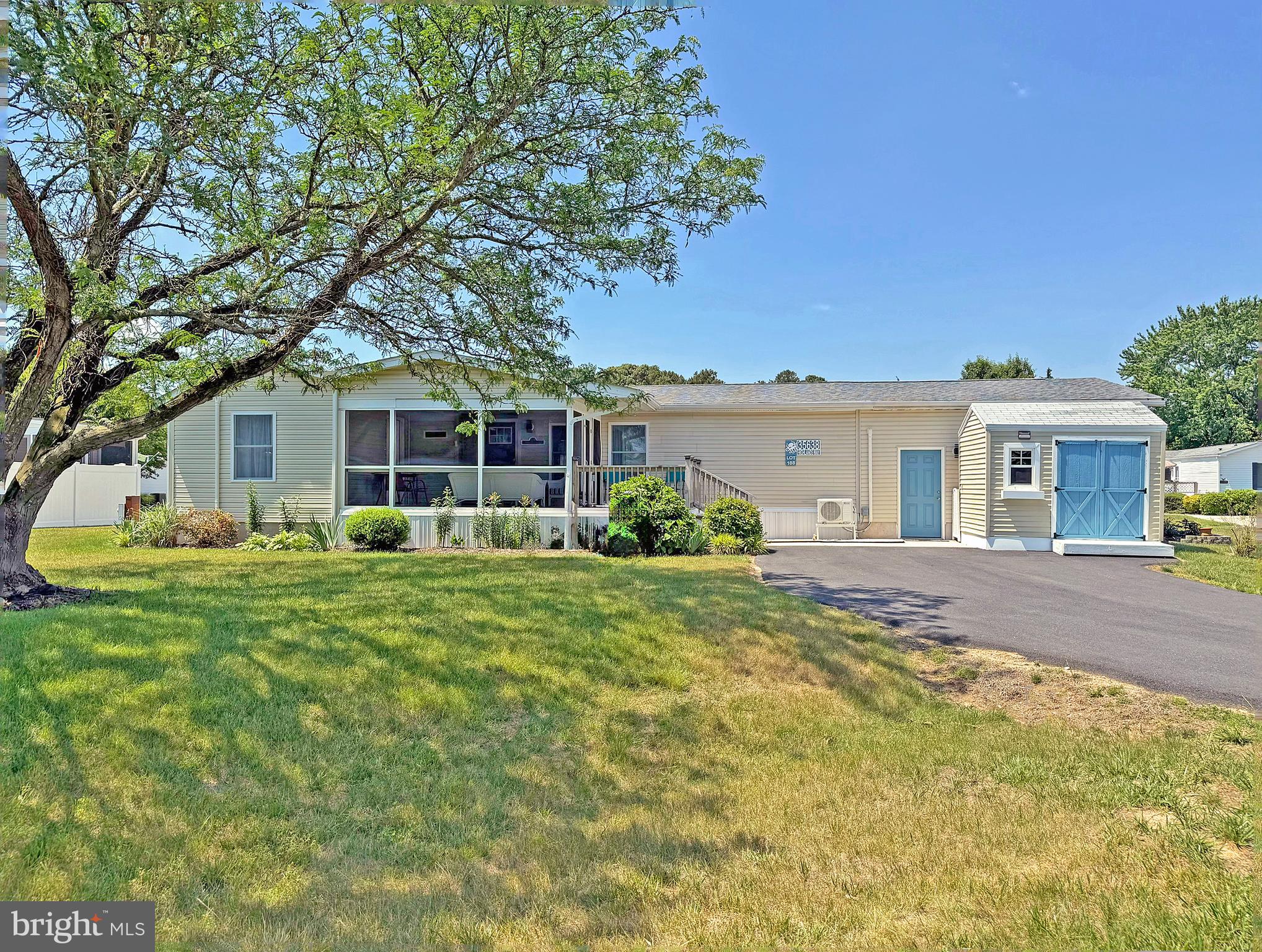 Aspen Meadows is the place to be if you want a beach get-away...but this home is luxurious enough for your year-round residence. Aspen is located less than a 4-mile drive to the famous Rehoboth Beach boardwalk. And it’s only 5 miles to the Lewes public beach, with the Cape Henlopen State Park beach not much farther away. The Wolfe Neck trailhead to the State Park’s hiking/biking trail is right down the road if you prefer to bike to the beach. And you're near the community pool and clubhouse, which has a fitness center. Stunning, full remodel on this spacious doublewide home, which includes a 10’x10’ home office addition for +1,200 sq. ft. of living space. Vaulted ceilings, drywall finishes, and luxury vinyl plank flooring throughout gives the space a modern look. The open concept has the living room, dining area, and kitchen all adjoining. The kitchen remodel is a gourmet coastal contemporary design with striking blue lower cabinets paired with white shiplap, solid surface countertops, and a stainless steel appliance package. The appliances include a smooth-top electric range, range hood, dishwasher, and a fridge with an icemaker. The laundry room is located off of the kitchen. The dining area has a sliding glass door to the 12’x20’ deck so you can easily entertain & dine al Fresco! There’s also a front screened porch. This home has a popular split bedroom plan. The main bedroom is en Suite. That bath has a tub/shower combo and a large sink vanity. The main bedroom also has a walk-in closet that runs the length of the room. The second bedroom is across the hall from the third bedroom. The home office addition can be access through bedroom #3 or from a private entry door on the screened porch, so this set up would be ideal as an in-law suite! The second full bath has a beautifully tiled walk-in shower. Lots of parking with two driveways (1 on Highlands, and 1 on Snowmass). This home also has a two-car garage. The garage and the home office addition both have individual HVAC heat pump mini-split systems for heat and AC. The main house is serviced by a traditional HVAC. There’s a storage shed for your beach and gardening gear. And an E-Z GO golf cart is included, but it will need a new battery. Leasehold Interest: current Lot Rent is $909/mt. The Lease’s annual renewal date is October 1, with any increase capped as per 25 Del. C. Sec. 7050-7054. Lot rent includes trash/recycle, seasonal lawn service, and the pool & fitness center memberships. Homeowner pays electric, water, sewer & Internet (Comcast Xfinity). Equity LifeStyle Properties, Inc., the community owner, requires an Application from the Buyer, with acceptance based on the following criteria: 1.)income verification, 2.)credit bureau score, plus evaluation of debt-to-income ratio, and 3.)criminal background check. (Note: Family & friends may always visit, but rentals are NOT permitted in this community.) Financing may be available to qualified borrowers from only a very few Lenders that specialize in installment/chattel loans for manufactured homes on leased land. Closing costs will include the real estate transfer tax (3.75% DMV Doc Fee), Settlement Agent fee, and pro rata adjustments.