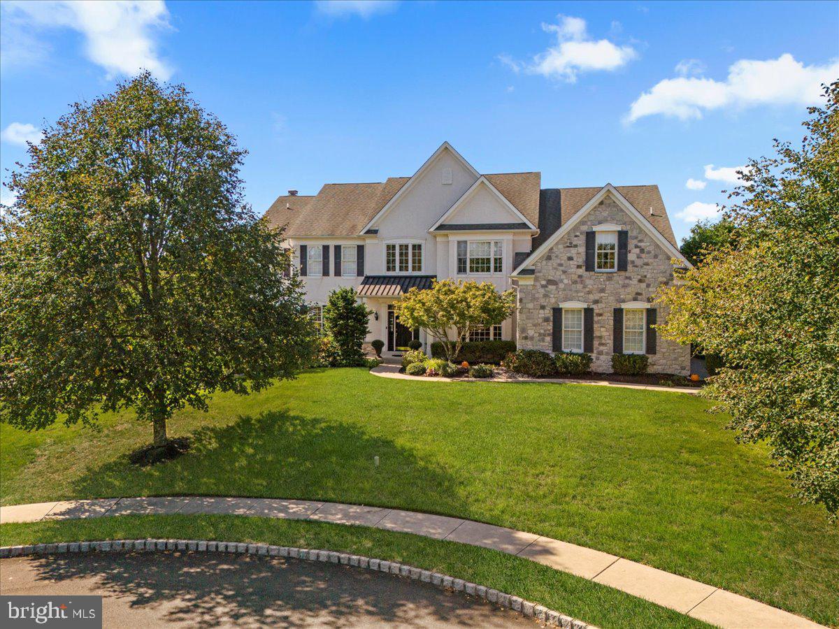 Rare Opportunity in Ridings of Warwick—Luxury, Elegance, and Prime Location! Homes in this coveted neighborhood are rarely offered, making this 4,400+ sq.ft. Colonial a unique opportunity. Nestled at the end of a tranquil cul-de-sac, this 5-bedroom, 3 ½ bathroom home offers space, elegance, and a highly sought-after location. Step inside the grand foyer, where an impressive, curved staircase greets you and sets the tone for the refined craftsmanship throughout the home. Gorgeous hardwood floors add warmth and elegance and continue into the Living Room. Double French doors at the end of the Living Room lead into the first-floor study, ideal for a home office or library. The spacious Dining Room, enhanced with elegant woodwork, is adjacent to the bright and inviting kitchen. This culinary delight features white cabinetry, granite countertops, and a tumbled marble backsplash. The gas cooktop, double wall ovens, and a warming drawer are the perfect tools for preparing and serving meals at the granite island with seating. A sunny, two-story breakfast room with large sliding glass doors opens to the stone patio and hot tub, offering peaceful views of the serene backyard. A paved path behind the property connects to over three miles of scenic trails, perfect for walking, jogging, or biking. The spacious Family Room is perfect for gatherings, with its cozy gas fireplace and a wall of sunburst windows. Additional conveniences on the main level include a Laundry Room with utility sink, outdoor access, and a second staircase. Upstairs, the Primary Bedroom Suite is a true retreat. Featuring a tray ceiling and a private sitting room, this suite offers a dressing area with two walk-in closets. The Primary Bathroom has a vaulted ceiling, double sinks, a jetted tub, and a seamless glass shower shall. A Prince/Princess Suite boasts its own en suite bathroom, while another full bathroom is shared by the other three bedrooms. One of these bedrooms has direct access to the bathroom, while the remaining two bedrooms share access from the hallway. This home also offers abundant storage, including extra areas in the 3-car garage (with electric car charger) and a full basement with 9-foot ceilings—perfect for future finishing to create even more living space. The multi-zone temperature control system ensures optimal comfort for all occupants, and with the home's built-in connection to a whole-house generator, you're prepared to maintain that comfort even during power outages. This home offers easy access to Philadelphia, NYC, and NJ, while being just minutes from the historic towns of Doylestown, Newtown, and New Hope—each known for vibrant shopping, dining, and cultural attractions. Plus, it’s located in the award-winning Central Bucks School District. Spectacular views, a thoughtful layout, and luxurious details throughout. Don't miss out on this rare opportunity—schedule your tour today!