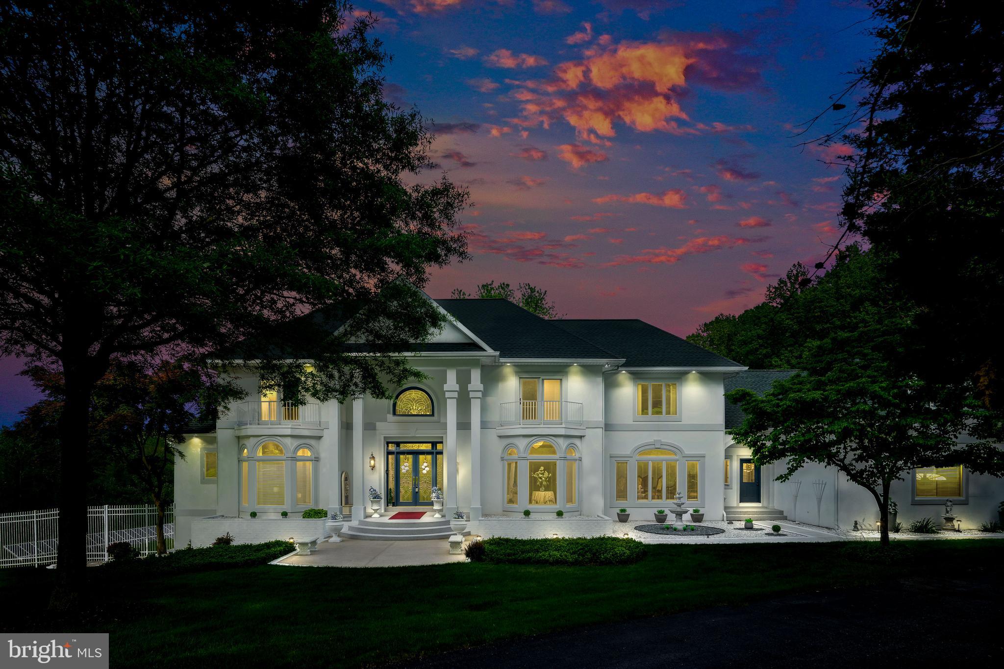**OPEN HOUSE Cancelled**Welcome to 9 Chamaral Court.  This Stunning Custom-Built Home, tucked-away on almost 10 acres of beautifully landscaped grounds offers over 8,600 total square feet featuring 5-Bedrooms, 5-Full Baths, 2-Half Baths, 4-Car Garage and is in one of most sought-after areas in Baltimore County.
Nestled at the end of a long, private driveway that exudes an air of exclusivity and tranquility.  Surrounded by lush greenery and towering trees, a sense of anticipation builds, drawing you closer to the treasure that awaits.  As you step inside, you'll be greeted by a grand foyer with high ceilings, marble floors laid on a diagonal, a curved staircase and a stunning chandelier that cascades a warm glow throughout. 
The spacious family room in this meticulously maintained home offers a seamless blend of indoor and outdoor living, creating a harmonious flow that enhances the overall living experience. Adorned with French doors, this inviting space effortlessly connects to the outdoor covered patio area, inviting nature's beauty to become an integral part of your daily life.  The cozy living room, with a propane fireplace, invites you to unwind and enjoy moments of quiet contemplation, while the adjacent formal dining room sets the stage for memorable gatherings and celebrations. The newly remodeled gourmet kitchen is a chef's dream, boasting all new stainless-steel appliances, custom cabinetry, and a center island with new Quartz counter-tops, serves as a focal point for culinary creativity.
The main level also includes a luxurious primary suite with a sitting area, two walk-in closets, and a newly remodeled spa-like bathroom with a jacuzzi tub, His and Her vanities, and a large walk-in shower.  A Butler’s pantry, laundry room, two half bathrooms, several storage and coat closets round out the main level.
Upstairs, you'll find four additional bedrooms all generous in size with plenty of closet space and two with En-suite bathrooms.  An additional full bath is in the hallway and at the end of the hall, above the 4-car garage there is a huge unfinished room with a rough-in that offers so many possibilities!
The walk-out lower level includes a recreation room with a billiards table that is included, a back storage area that is currently being used as a home gym, a full bath with a two-person steam shower, a Kitchenette and catch up with your favorite movies in the Home Theatre room.
Stepping outside, the impeccably maintained grounds reveal an oasis of serenity.  A sprawling backyard offers endless possibilities for outdoor activities and relaxation, whether it's lounging by the sparkling pool or gazebo, hosting dinners on the patio, or exploring the paths that take you down to your very own private stream.
Other notable features of the property include a newer roof installed 7 years ago, 3-Zone Heating and Cooling system, freshly painted throughout, well pump within 10 years, new Luxury Vinyl Plank Flooring, Tray Ceilings, Crown Molding, surround sound speakers throughout, epoxy coating in garage, 3-Zone irrigation system, low-maintenance composite decking, 2-Pellet Stoves, Radon Mitigation system and enjoy the convenience of having low energy bills with solar panels. 
With its stunning finishes and incredible amenities, this property truly has it all. Don't miss out on the opportunity to make it your dream home.  Prepare to be impressed.  CHECK OUT THE AMAZING 3D VIRTUAL TOUR!