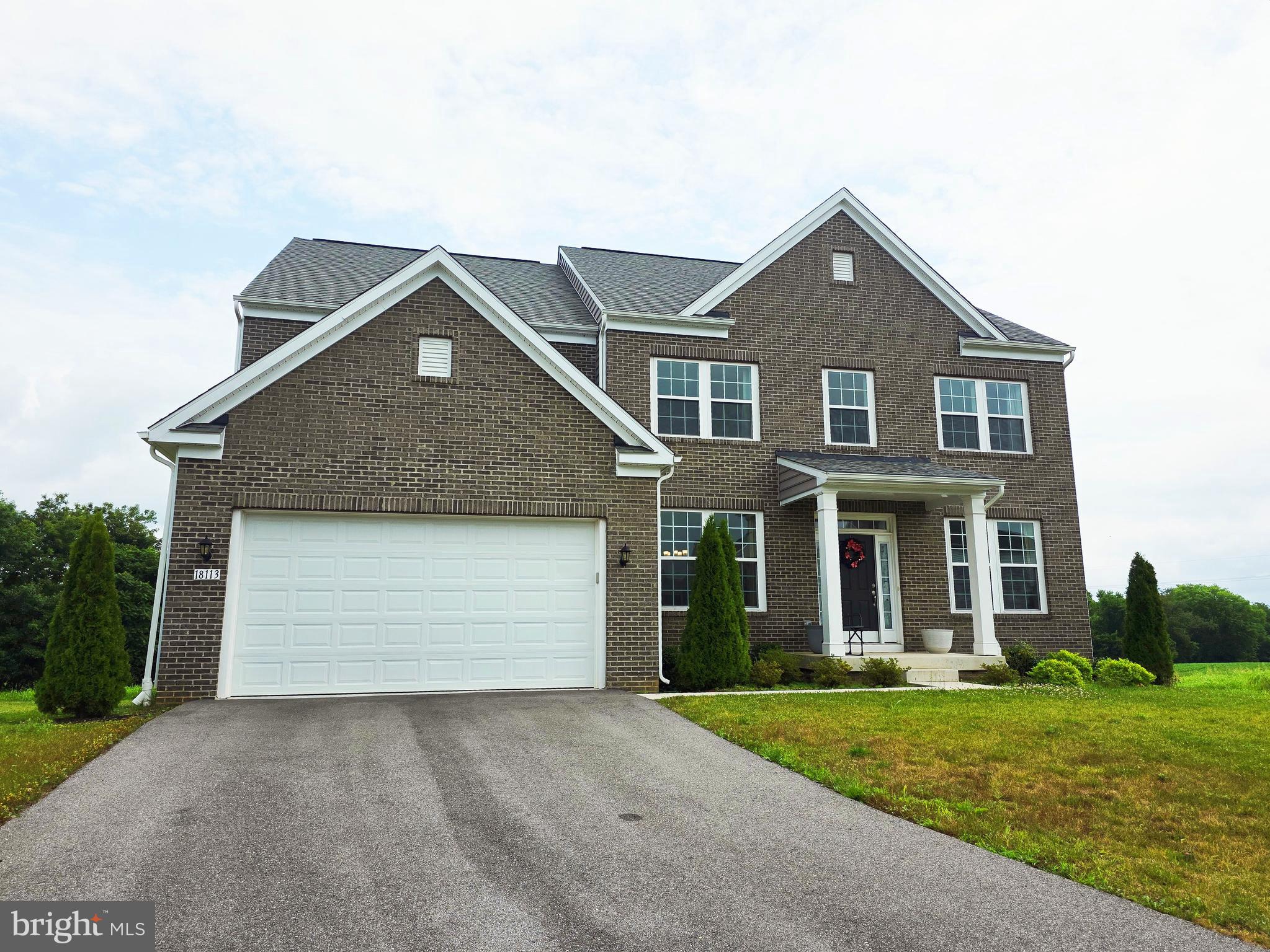 Welcome to this beautifully maintained 2022-built home in the highly desirable Westfields community, offering modern design, spacious living, and an exceptional location.

From the moment you step through the front door, you're welcomed by a bright and inviting formal living room and dining room, filled with abundant natural light. The thoughtfully designed main level features 9-foot ceilings, luxury vinyl plank flooring, and a seamless open-concept layout that flows effortlessly into the breathtaking two-story family room and expansive gourmet kitchen. Soaring ceilings and oversized windows fill the space with natural light, creating an impressive sense of openness that is perfect for both everyday living and entertaining. At the heart of the home, the gourmet kitchen features a large center island, stainless steel appliances, abundant cabinetry, and generous counter space. The builder-upgraded morning room extends the living area, providing the perfect setting for casual meals, morning coffee, or gathering with family and friends.

Upstairs, you'll find four generously sized 4 bedrooms and 3 full bathrooms, including a spacious primary suite designed for comfort and privacy.

The unfinished walkout basement offers endless possibilities to create the space you've always wanted. Whether you envision a home theater, guest suite, recreation room, fitness area, wet bar, or additional living space, this level provides incredible flexibility and direct access to the backyard.

Location is one of this home's greatest assets. Ideally situated within walking distance of the highly rated elementary school, it also offers access to outstanding community amenities, including a swimming pool, basketball courts, playgrounds, and scenic walking trails. Everyday conveniences are just minutes away, with Walmart, Wawa, shopping, dining, and other retail destinations all within a five-minute drive. Commuters will appreciate the easy access to I-70 and other major roadways, providing exceptional convenience for daily travel. Combining modern construction, a bright and functional floor plan, premium builder upgrades, outstanding future potential, top-rated schools, and an unbeatable location, this home presents one of the best values in the Westfields community and an exceptional opportunity you won't want to miss.