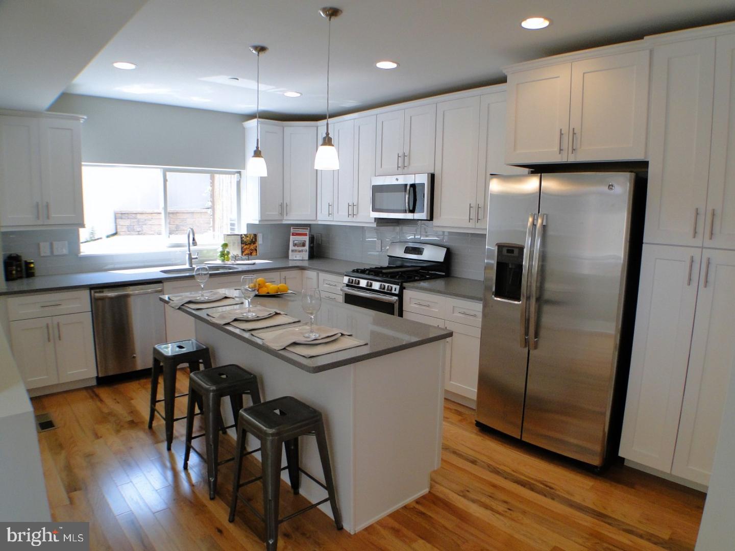 Come check out this brand new home in Northern Liberties. Enter the private entrance into the large living room, dining room combo with first floor powder room. The gorgeous chef's dream kitchen has an incredible amount of white shaker cabinetry, endless Quartz counter space, large center island, glass backsplash, stainless steel appliances, 5 burner stove, built in trash bin, under mount and pendant lighting to complete the look. There is also an incredible private fenced in rear & side yard with beautiful custom pavers perfect for al fresco dining and cookouts. Downside you will find a full finished basement perfect for a man cave or rec room. Head upstairs to the second floor where there are 2 bedroooms and 2 full baths. The front bedroom consists of master suite with full master bath consisting of oversized stall shower and dual vanity. The second bedroom is very spacious with plenty of closet space. The hallway has the 2nd full bath with custom ceramic tile. There is a separate laundry area equipped with front load washer and dryer. With everything Northern Liberties has to offer, fine dining, shopping, transportation, fitness centers and easy parking nearby, come visit this home today!