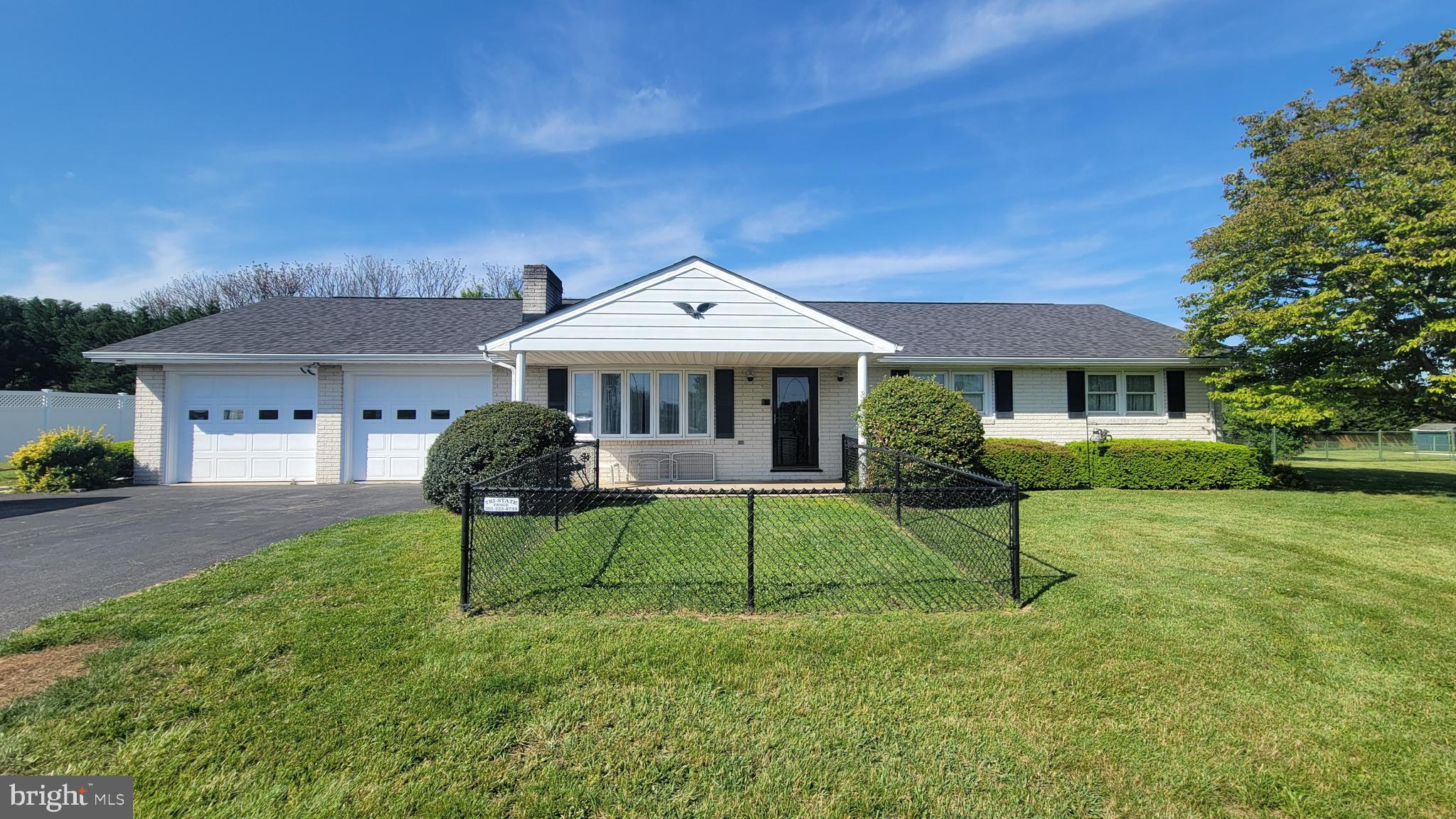 Spacious all-brick rancher on a nice level lot with in-ground swimming pool — your own private backyard retreat just in time for summer fun!   Features 3 bedrooms, 2 full baths, and a huge 27x30 family room addition perfect for entertaining or relaxing.  Sunny living room with fireplace,  eat-in kitchen with lots of cabinets and modern appliances.  Durable laminate flooring throughout much of the home.  Newer heat pump for efficient comfort and oversized double garage with convenient laundry facilities.    Full basement offers finished rec room/flex space with second fireplace, separate laundry area, and large storage room.   Small fenced area in front for pets and larger fenced area around patio & pool in rear.    Super convenient location with easy access to I-81, the Potomac River, and the historic C&O Canal bike path.    Call today to schedule your private showing!