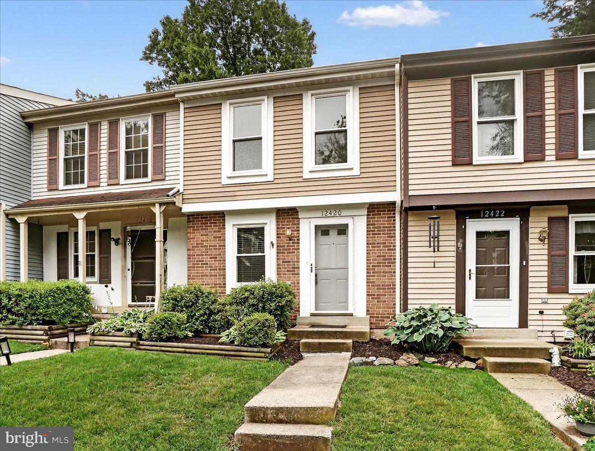 ***PRICE IMPROVEMENT!!** Welcome to 12420 Valleyside Way! A 2-bedroom, 1.5-bath townhouse with fresh paint and brand-new carpet throughout, this home is move-in ready. Owner has updated all major systems and features throughout including rear fence (2024), windows (2020), hot water heater (2019), kitchen appliances (2019), HVAC (2018), and a BRAND NEW ROOF (2025)! Main level includes kitchen in front of the home with a convenient pass-through window to the dining area. The living/dining room combo layout has sliding door access to the spacious deck that backs to beautiful wooded area. Upstairs are two bedrooms and a full bath. Master has cordless top down/bottom up window shades. The basement has full sized laundry and a 1/2 bath.  Rec room has French door access to large patio and fully fenced yard– perfect for outdoor relaxation or entertaining.  The well-maintained community offers plenty of parking,  minutes away from Gunners Lake and access to playgrounds, picnic area, basketball courts, tennis courts, a soccer field, and a swimming pool (with a separate fee). Easy access to major highways, shopping, dining, and entertainment options. Don't miss your chance to call this one home!