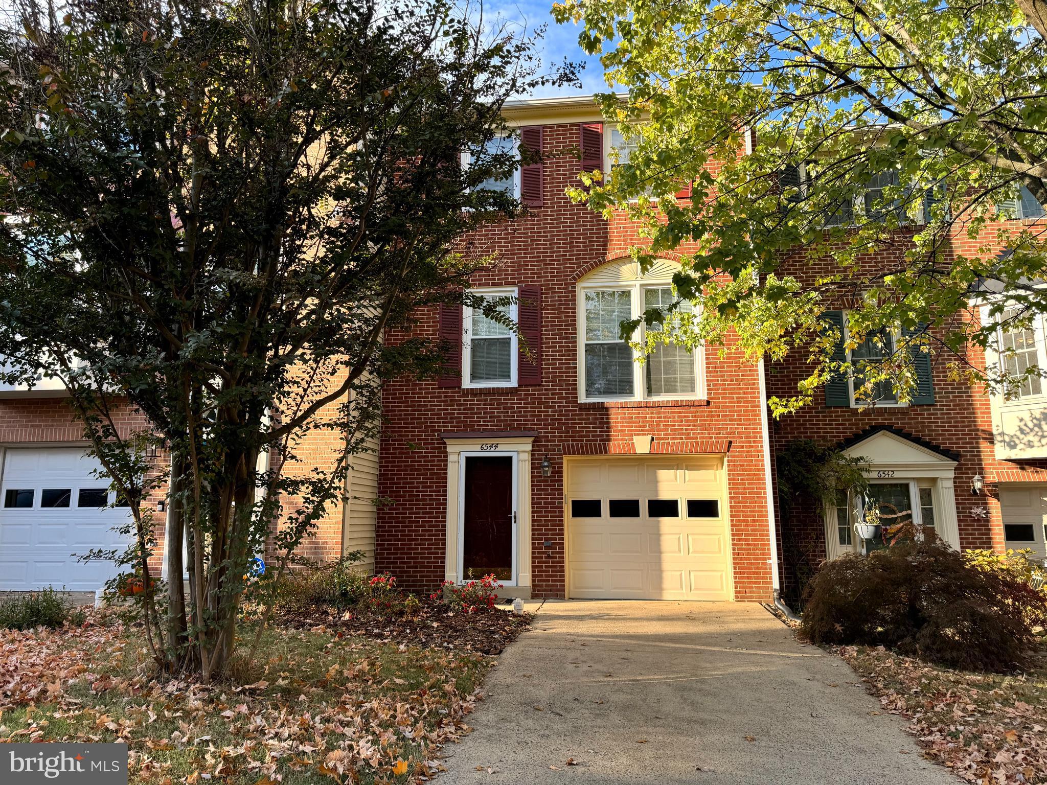 Welcome to 6544 Morning Meadow Drive, a gorgeous brick-front Hudson model in Alexandria's desirable Landsdowne neighborhood. This great home features gleaming hardwood floors on the stairs and main-level, an open concept floorplan, half bath, and neutral paint throughout. The updated eat-in kitchen boasts granite countertops, custom tile backsplash, stainless appliances, a breakfast area, and a nice open pass-thru to the dining room. Just off the kitchen is the delightful deck that spans the entire width of the home and backs to trees. Upstairs, there are 3 bedrooms and 2 full baths. The primary bedroom offers a vaulted ceiling and updated bath with granite vanity and stylish tile. Escape and relax in the lower level rec room with a cozy gas fireplace, laundry room, a half bath, and a sliding glass door leading you to the spectacular fully fenced-in flagstone patio. The townhome has a 1 car attached garage and an additional parking space assigned #379. New hot water heater and roof 2024. Landsdowne residents enjoy wonderful community amenities including an outdoor pool, basketball and tennis courts, tot lots and plenty of walking and jogging paths. It is also within walking distance to popular Wegmans, and a short drive to the Franconia-Springfield Metro and Fort Belvoir. There are lots of restaurants and shopping areas nearby too!  Owner/Agent. 1 small pet under 35 pounds will be considered with $500 pet deposit.