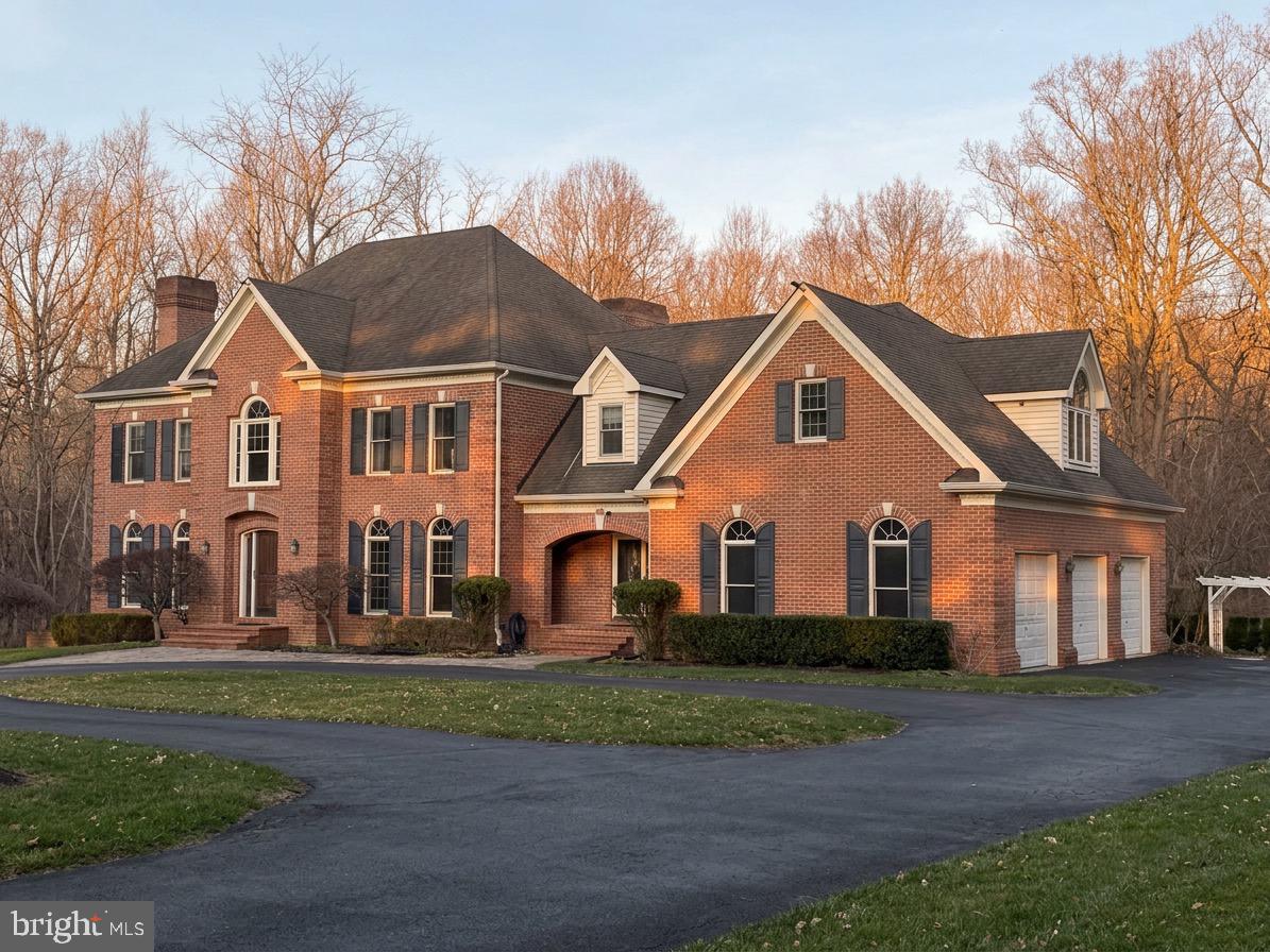 A rare offering of scale, craftsmanship, and opportunity; this custom-built all-brick estate is privately sited on 3+ wooded acres at the end of a quiet cul-de-sac, backing to a serene brook.

Constructed in 1994 with premium materials and enduring quality, 9409 Elizabeth Court showcases grand architectural elements rarely found today, including a dramatic two-story foyer with a sweeping staircase, soaring ceilings, and a striking two-story family room anchored by a floor-to-ceiling stone fireplace. With 6 bedrooms, 4 full baths, 2 half baths, and four finished levels, this home offers expansive, versatile living spaces designed for both everyday comfort and large-scale entertaining.

The existing layout aligns effortlessly with modern living, featuring multiple gathering areas, a spacious kitchen with dual-access staircase, and a fully finished lower level with 10-foot ceilings - ideal for recreation, guest quarters, multigenerational living, or future luxury amenities such as a home theater, gym, or wellness retreat.

While rich in character and built to a standard that stands the test of time, the home also presents a compelling opportunity for thoughtful updates to reflect today’s design preferences—allowing a new owner to personalize and elevate an already exceptional property.

Additional highlights include hardwood flooring, granite surfaces, a 3-car garage, whole-house Generac generator, walk-in pantry, step down whirlpool spa, and a charming treehouse nestled within the natural landscape.

Conveniently located with access to Washington, D.C., Annapolis, and Baltimore, this is a unique opportunity to acquire a home of significant presence, privacy, and lasting value.