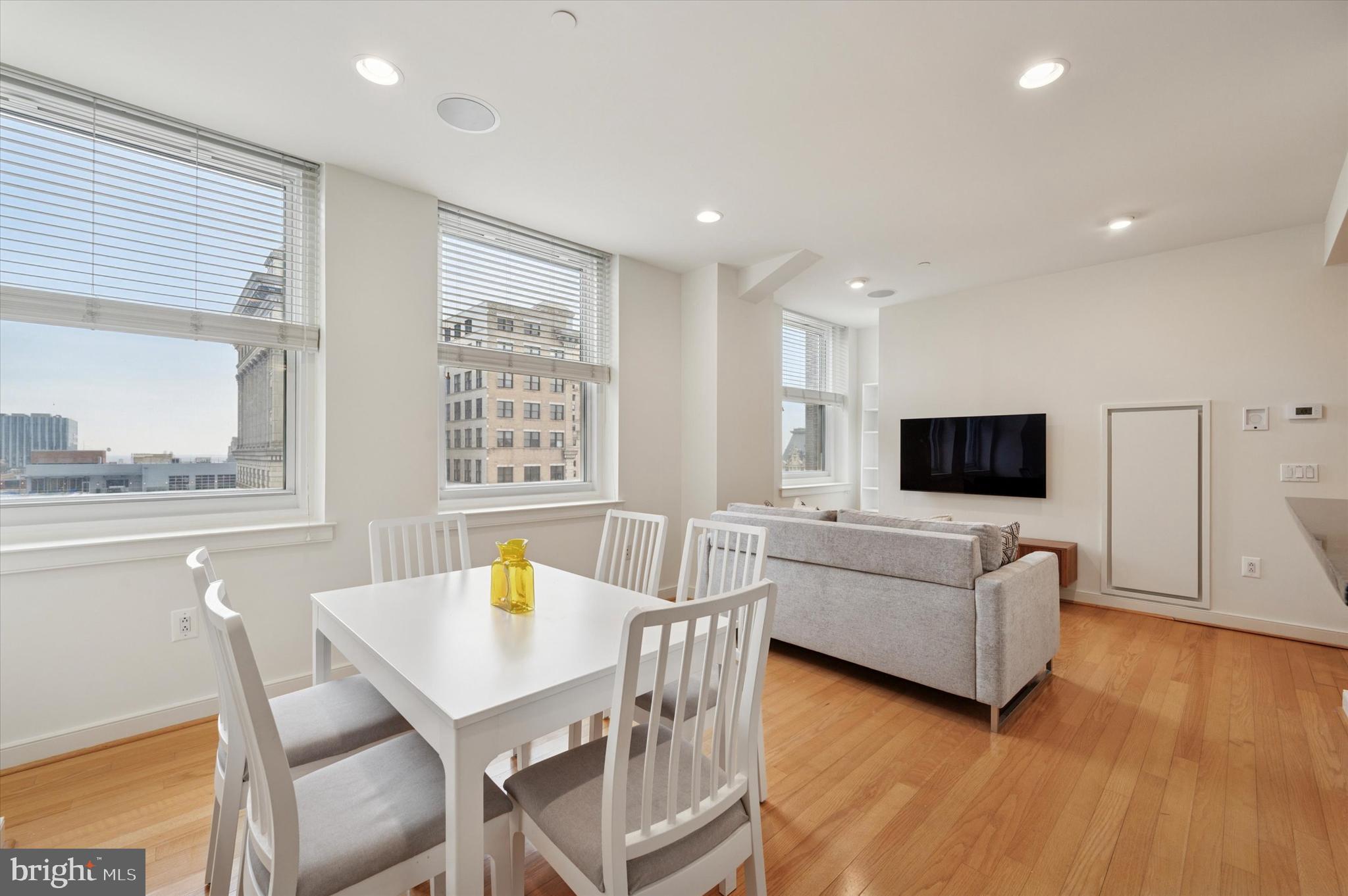 Discover the perfect blend of style and convenience in this large one-bedroom residence at the Packard Grande Condominiums. Perched high above the city on the 22nd floor, this home boasts elegant living and dining areas with 9-foot ceilings, bamboo floors, and oversized windows that fill the space with natural light. The gourmet kitchen features granite countertops, shaker-style cabinetry, stainless steel appliances, and a breakfast bar ideal for casual dining. The spacious bedroom features plenty of closet space, and the updated, luxurious bathroom perfectly complements the unit. Enjoy premium amenities, including 24-hour concierge service, a breathtaking rooftop deck, and an on-site fitness center, all within a pet-friendly building. Valet parking is available in a public garage next door. Perfectly situated in the vibrant Rittenhouse/Avenue of the Arts district, this residence places you just steps from fine dining, unique shopping, and lively nightlife.
