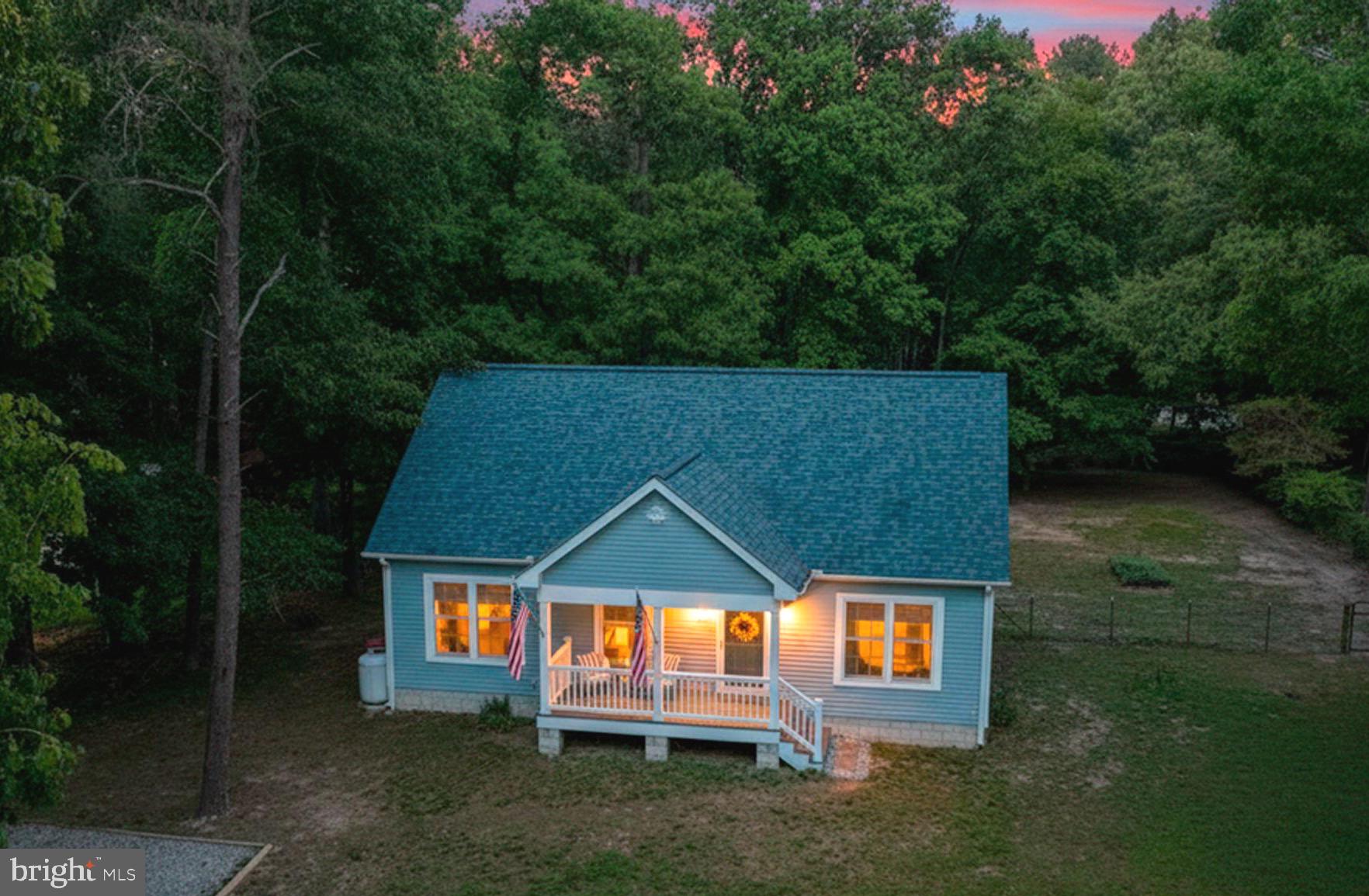 **NEW PRICE**Practically brand new and just 2 years young, this beautifully maintained home is perfectly situated in a desirable water-oriented community—offering the best of Eastern Shore living! Located in the Queen Anne’s County school district and just minutes from downtown Chestertown, you’ll love the convenience paired with the peaceful setting.
Enjoy easy access to the Chester River—you can drive your boat to the community ramp at the end of the street, or even take a nice short walk down to the water, to spend your days crabbing, fishing, kayaking, or simply soaking in the waterfront lifestyle.
Inside, this 3-bedroom, 2 full bath home features durable and stylish LVP flooring throughout and a thoughtfully designed split floor plan. The spacious primary suite is privately situated on one side of the home and offers a walk-in shower, dual vanity, and a beautifully appointed bath. On the opposite side, you’ll find two additional bedrooms and a full bath with a tub/shower combo—ideal for guests or flexible living.
The kitchen and living room are centrally located, creating an inviting and functional space for everyday living and entertaining.
A standout bonus—an unfinished upstairs area of 544 additional SF, already in place and ready for your vision! Use it for storage now or finish it off for additional bedrooms, a home office, or recreation space.
Step outside and enjoy both a charming front porch—perfect for morning coffee—and a massive back deck ideal for entertaining, grilling, or simply relaxing while taking in the peaceful surroundings. The generously sized yard with mature trees offers both privacy and room to enjoy the outdoors.
Even more exciting—the county has indicated plans to pave the road in the near future.
Added perk: fiber optic Talkie Internet is already available at the property, making working from home or streaming a breeze.
Move-in ready, full of potential, and located in a charming waterfront community—this one checks all the boxes!