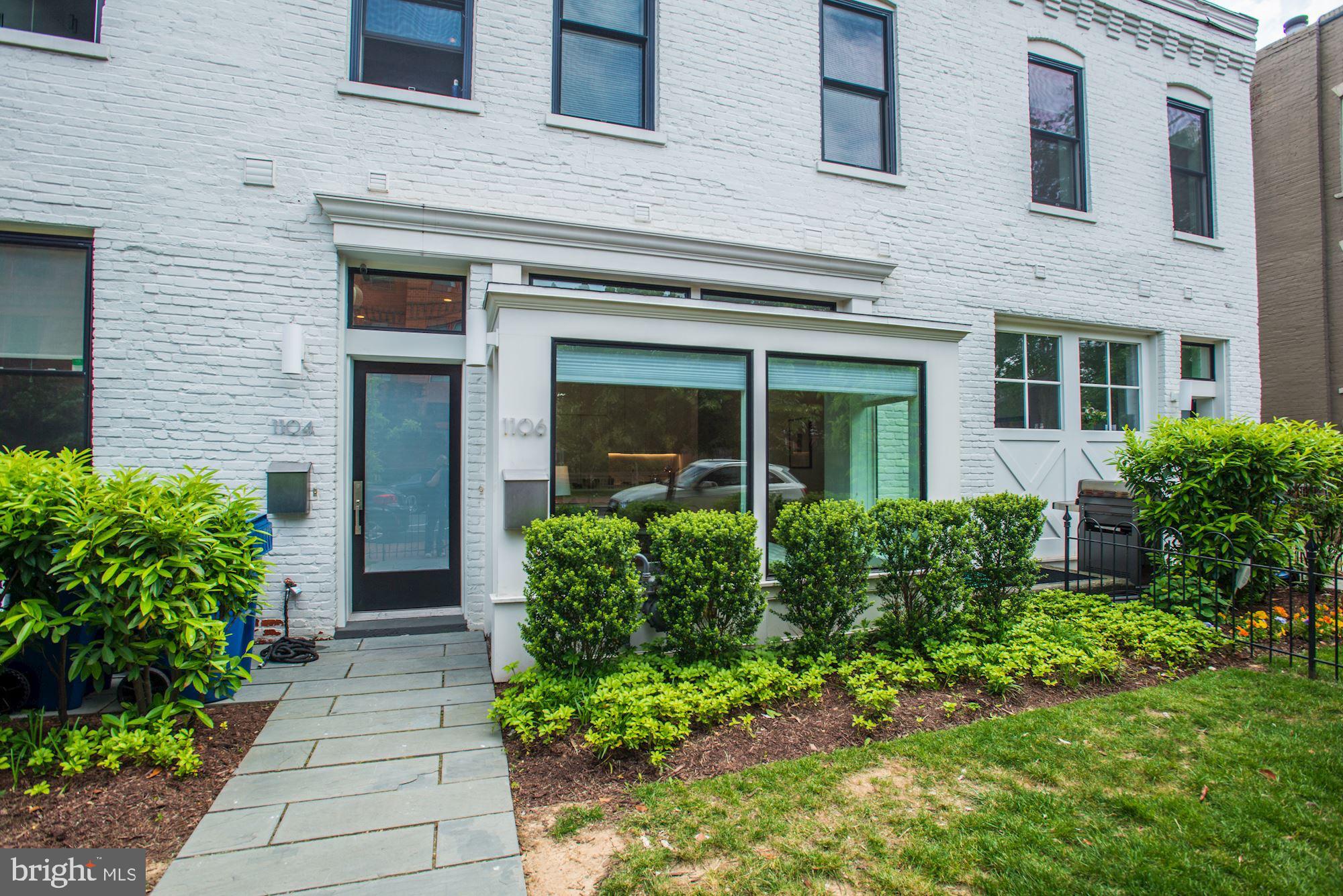This gorgeous contemporary three-level residence is situated on a tree-lined, quiet street right in the middle of one of the most exciting and accessible neighborhoods in DC.  This bright, airy home has an open floor plan on the main level with large windows bringing in tons of sunlight throughout the day.  It features an open gourmet kitchen with top-of-the-line stainless steel appliances, with a large island for a quiet dinner or a larger gathering.  Upstairs features a primary suite with custom wall-to-wall built-in cabinets. The en-suite white marble bathroom has a large glass-enclosed rain shower.  Just a few steps out of this primary suite is access to a full rooftop deck with great views of the surrounding neighborhoods. The lower level includes a nice-sized second bedroom and a third room which can be used as a guest bedroom or in-home office, as well as a second bathroom with a full-size soaking tub/shower and a full-size washer & dryer. 2-zone heating/air conditioning installed February 2022. 1106 T has hardwood flooring throughout and the best in designer kitchen and bath detailing and fixtures.  There is ample closet space in every room. Fresh new paint throughout.