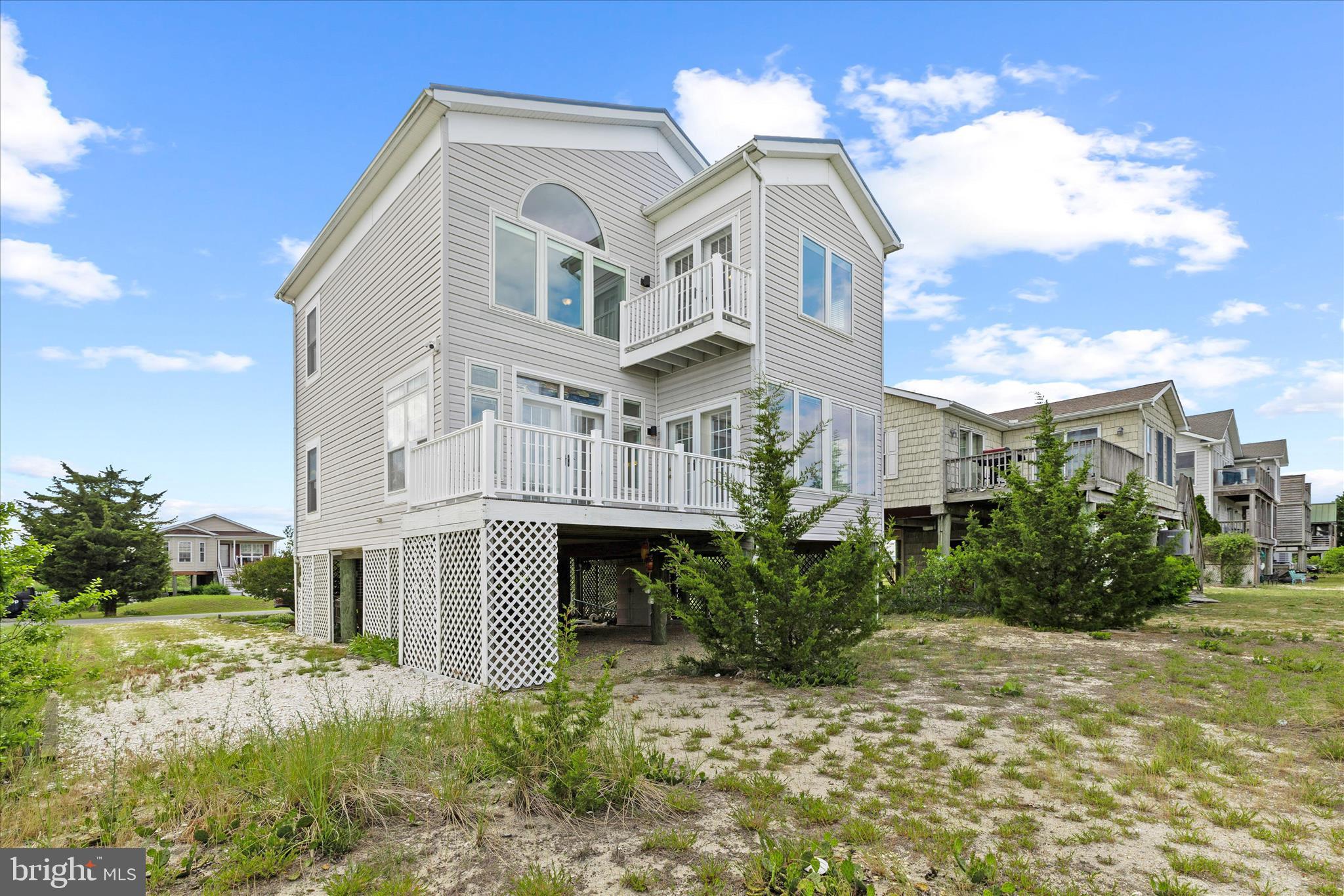 Welcome to 115 Beach Plum Drive, a rare opportunity to own your own slice of Delaware Bay waterfront in the peaceful coastal community of Slaughter Beach. Nestled on a quiet cul-de-sac, this beachfront retreat offers unobstructed bay views, breathtaking sunrises, and a front-row seat to one of Delaware's most treasured natural environments.

Inside, the home combines coastal charm with thoughtful updates and modern comfort. The refreshed kitchen features new quartz countertops and brand-new stainless steel appliances, while refinished hardwood floors add warmth and timeless appeal throughout the living spaces. Vaulted ceilings, abundant natural light, and  20 new energy efficient high end expansive windows create an inviting atmosphere that showcases the stunning waterfront scenery.

Offering three bedrooms with additional space suitable for a fourth bedroom, the home provides flexibility for family, guests, or a home office. Individual mini-split heat pumps in every room, controlled by smart thermostats, deliver efficient year-round comfort, while a cozy gas fireplace creates the perfect gathering space on cooler evenings.

Built for both style and durability, the property features a long-lasting metal roof and newly installed low-maintenance composite decking—ideal for entertaining, enjoying morning coffee, or relaxing beneath the stars. Covered parking beneath the home accommodates up to three vehicles, with additional space for guests, boats, or trailers.

Life at Slaughter Beach means living in harmony with nature. Watch horseshoe crabs come ashore, observe migratory birds along the Atlantic Flyway, and enjoy the calming rhythm of the Delaware Bay. Whether you're seeking a full-time residence, weekend getaway, or investment opportunity, this property offers a truly unique coastal lifestyle.

Nature enthusiasts will appreciate being just moments from the DuPont Nature Center, featuring educational exhibits and observation decks overlooking the Mispillion Harbor and Delaware Bay. The nearby Slaughter Beach Boardwalk winds through protected marshes and wetlands, providing exceptional wildlife viewing opportunities. Additional outdoor recreation awaits at the Milford Neck Wildlife Area and Abbott's Mill Nature Center.

Residents also enjoy convenient access to community amenities, including a public pavilion, playground, basketball and tennis courts, and ample public parking. Boating enthusiasts will appreciate nearby Cedar Creek Marina, indoor boat storage options, marine services, and easy access to the Delaware Bay via the Mispillion Inlet. A modern public boat ramp is located just minutes away.

The historic town of Milford is a short drive from your doorstep, offering charming boutiques, local restaurants, art galleries, community events, and a vibrant riverfront district. Enjoy attractions such as the Riverwalk, Goat Island, the Riverwalk Freedom Festival, and the popular Ladybug Music Festival. Bayhealth's campus and a newly renovated golf course are also conveniently nearby.

Surrounded by protected wetlands, the tranquil waters of the Delaware Bay, and miles of untouched natural beauty, this unique coastal setting offers a rare escape from the pace of everyday life. Here, development is limited, nature takes center stage, and the landscape remains much as it has for generations.

Wake each morning to the sounds of shorebirds and gentle bay breezes. Spend your days watching wildlife thrive in its natural habitat—from migratory birds soaring overhead to horseshoe crabs gathering along the shoreline. Vast marshes, open skies, and endless water views create a sense of peace that is increasingly hard to find.

This is a place where life slows down, where sunsets are an evening ritual, and where the rhythm of the tides replaces the rush of the clock. Far from crowded beaches and busy streets, yet close enough to modern conveniences, it offers the perfect balance of seclusion and accessibility.