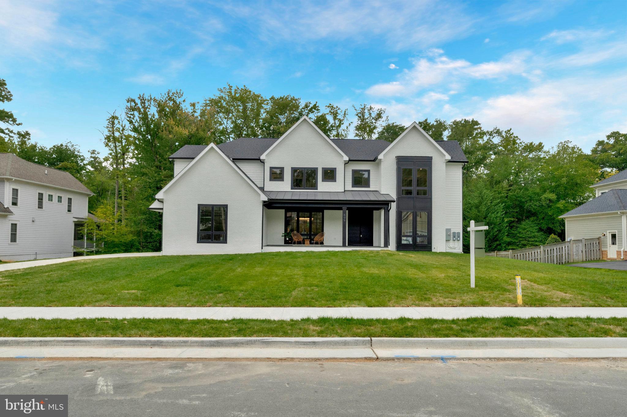 Welcome to the town of Vienna's newest luxury listing, a stunning home that epitomizes luxury and finish. This expansive home boasts 7 bedrooms. 7 baths and 3 half baths, encompassing an impressive 8,000 square feet of meticulously designed living space.  Situated on a generous half acre lot backing to the W&OD trail, this spacious and open floor plan seamlessly blends sophistication with comfort. The main level features an inlaw suite, office, formal dining room with a spacious mudroom that offers a pet spa/stylish utility sink.  The gourmet kitchen has an oversized island, custom cabinets and a Wolf/Subzero pkg.  The kitchen island overlooks the large breakfast nook along with the expansive living room that accesses the porcelain tiled screened in porch and one of four fireplaces.  The sliding glass doors in the breakfast nook and living room open fully to offer the opportunity to bring your outdoor space inside.    The screened in porch also offers a retractable screen for additional sunlight.  Upstairs the large master suite comes equipped with a dual sided fireplace,  expansive balcony, beautifully finished walk in closet.  The master bath has a large soaking tub and spa quality shower with multiple shower heads coming from every direction.  Each secondary bedroom has a bathroom en suite and a spacious closet. The finished basement provides additional living space, perfect for entertainment or a home gym and has a Movie Theatre and large wet bar.  Located near Westwood Country Club, this home offers convenient access to a range of recreational activities and walkability.