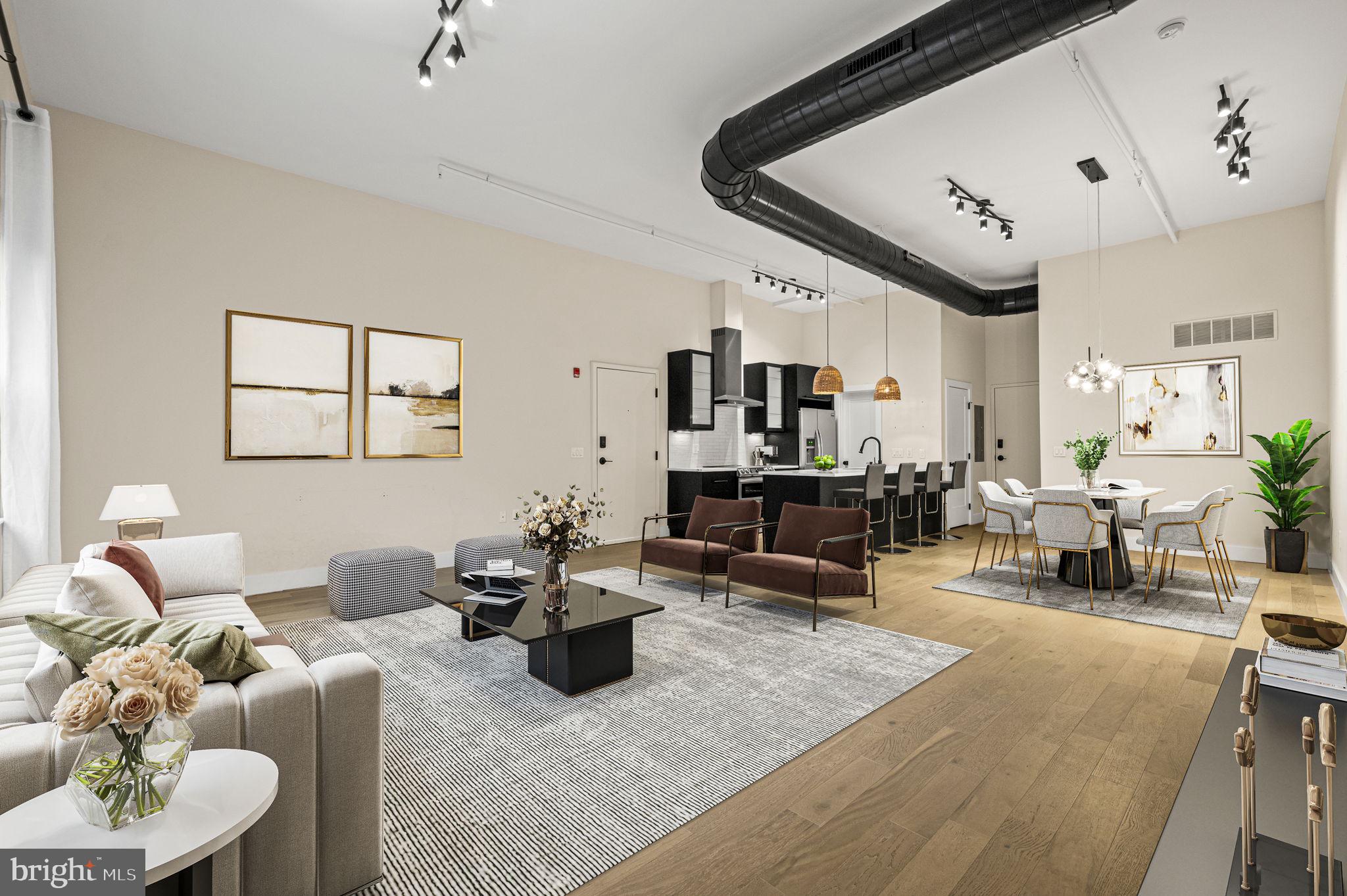 Price Improved and recently appraised to match price. Welcome to a fully reimagined luxury loft residence in the heart of Northern Liberties, offering dramatic scale, refined finishes, and approximately $125,000 in recent renovations.

This expansive 2-bedroom, 2-bath home is defined by soaring 16-foot ceilings, oversized open living space, and striking architectural details including exposed ductwork,  designer lighting, and wide-plank hardwood flooring throughout. The result is a rare combination of modern sophistication and authentic loft character.

At the center of the home is a stunning chef’s kitchen, newly installed and designed for both entertaining and everyday living. The space features custom cabinetry, quartz countertops, a large statement island, and brand-new appliances including oven, microwave, dishwasher, and exhaust hood. The open layout flows seamlessly into the oversized living and dining area, creating an exceptional entertaining space rarely found in city condominiums.

The primary suite offers a true retreat, featuring a large walk-in closet with built-in storage and a beautifully designed spa-inspired bathroom. The primary bath includes a freestanding soaking tub, oversized glass shower, and elegant finishes that create a calm area for respite.

The second bedroom also includes a walk-in closet, while the second bathroom has been completely renovated with new fixtures, tilework, and modern finishes.

Additional recent upgrades include:

• Brand-new flooring throughout
• New washer and dryer
• New hot water heater
• New lighting fixtures throughout
• New solid-core interior doors, trim, and hardware
• Completely renovated bathrooms

The home also offers a private entrance to the unit, a rare and valuable feature. Also, included with the property is an assigned parking space with additional storage.

The condominium building itself has recently undergone significant improvements, including:

• New roof installed January
• New garage door installed January
• New building entry door
• New security camera monitoring system for the lobby and garage

The rooftop deck was temporarily removed during the roof replacement and is planned to be reinstalled, offering additional outdoor amenity value.

Located on one of Northern Liberties’ most desirable streets, this residence places you steps from the neighborhood’s best restaurants, cafés, parks, and nightlife while offering the scale and comfort of true loft living.

A rare opportunity to own a fully renovated luxury loft with parking in one of Philadelphia’s most vibrant neighborhoods.