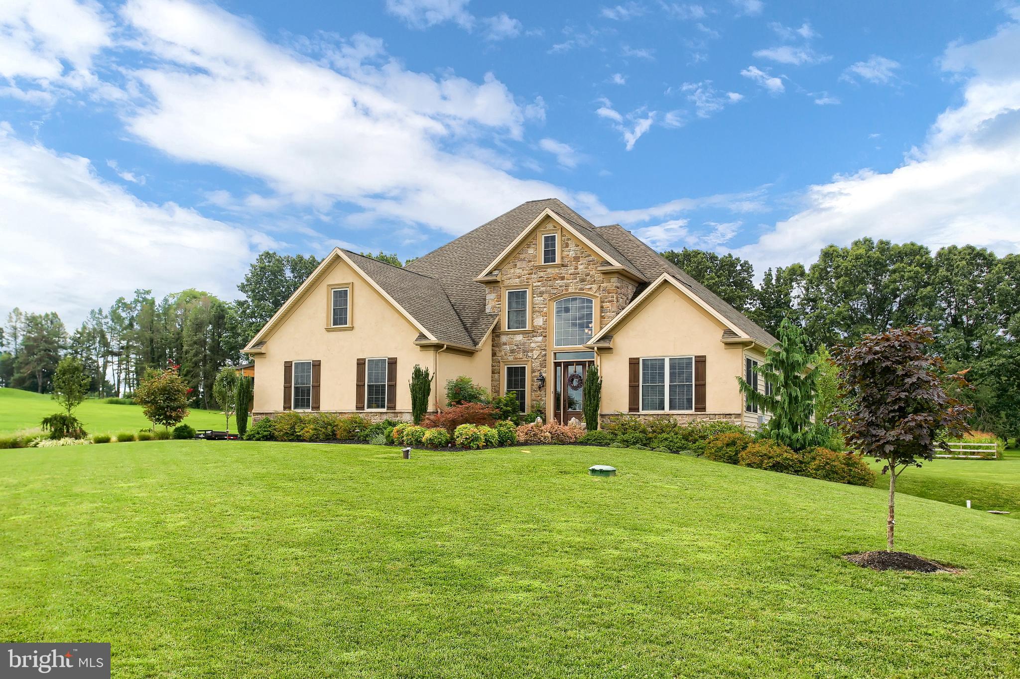 A beautiful custom built home  located in a rural setting yet close to shopping and dining.  Only 6 years young it offers a first floor master suite with cathedral ceiling & cove lighting and 3 other bedrooms, 2 full bathrooms and craft/home schooling room on the second level.  It also includes a beautiful gourmet kitchen with SS Kitchen-Aid appliances soft close doors & drawers, island and under cabinet lighting,  double sided gas fireplace in the 2-story great room with coffered ceiling, beautiful wood and tile floors, 1st floor laundry, security system, 2 acre lot, 3 car garage,  covered stamped concrete patio, gorgeous landscaping, full basement of over 2000 sq. ft. to finish for more living space or to use as storage.  You must see and experience this property!