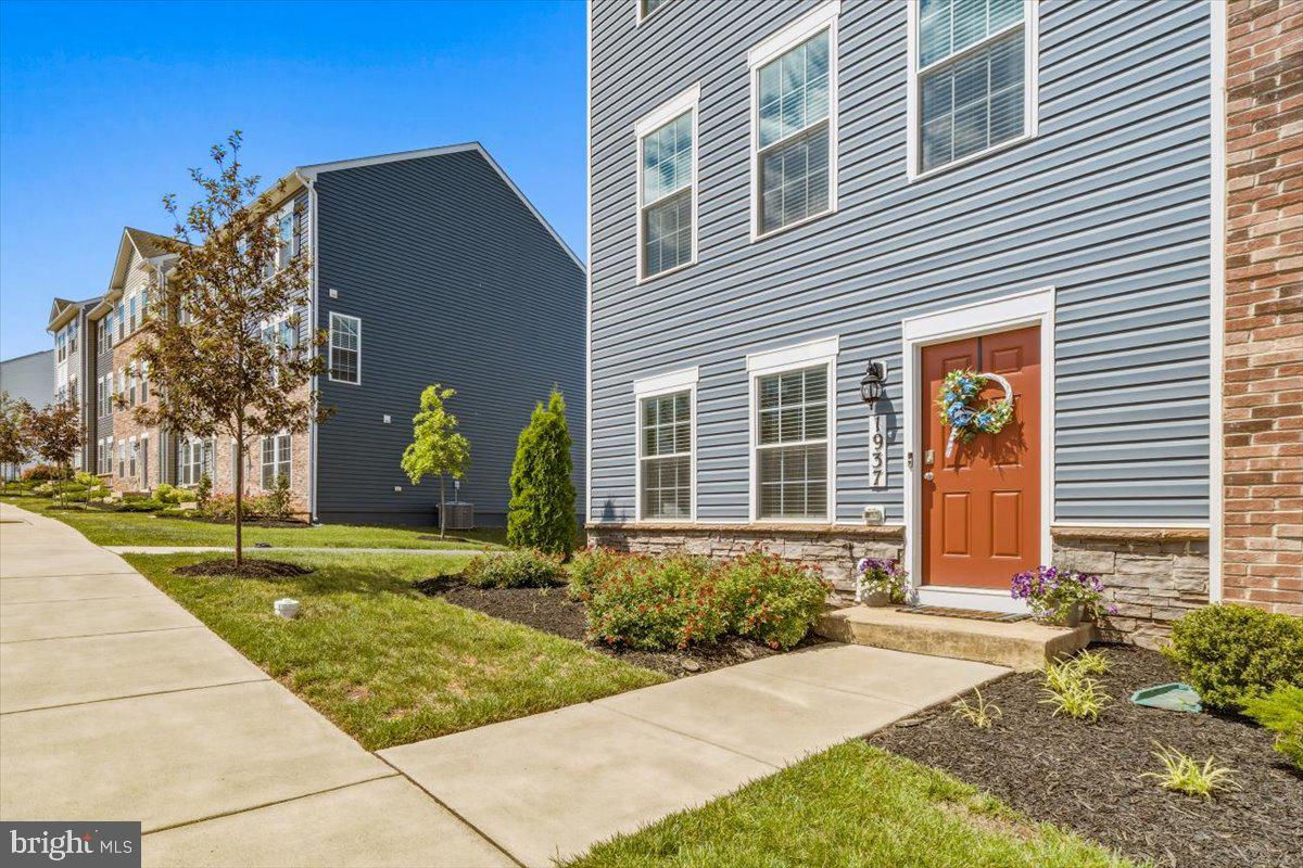 Welcome to this beautifully maintained end-unit townhome offering the perfect blend of style, space, and natural light throughout. From the moment you arrive, the charming curb appeal, inviting front entry, and extra privacy of the end-unit setting make this home feel special.

Step inside to discover an open-concept main level featuring luxury vinyl plank flooring, recessed lighting, and an airy layout designed for both everyday living and entertaining. The spacious living room flows seamlessly into the gourmet kitchen complete with granite countertops, stainless steel appliances, rich cabinetry, a large center island with seating, and plenty of prep space. Just off the dining area, enjoy easy access to the private deck perfect for morning coffee, grilling, or relaxing outdoors.  

Upstairs, the spacious primary suite offers a peaceful retreat with a large walk-in closet and en-suite bath featuring dual vanities and granite countertops. Additional bedrooms provide flexibility for guests, a nursery, home office, or growing household needs.

The oversized two-car garage, abundant natural light, and modern finishes throughout make this home truly move-in ready. Conveniently located near shopping, dining, commuter routes, and community amenities, this one checks all the boxes for low-maintenance living with style.

Take a walk just across the street to the park or stroll the neighborhood to meet new friends!

EV CHARGER CONVEYS!