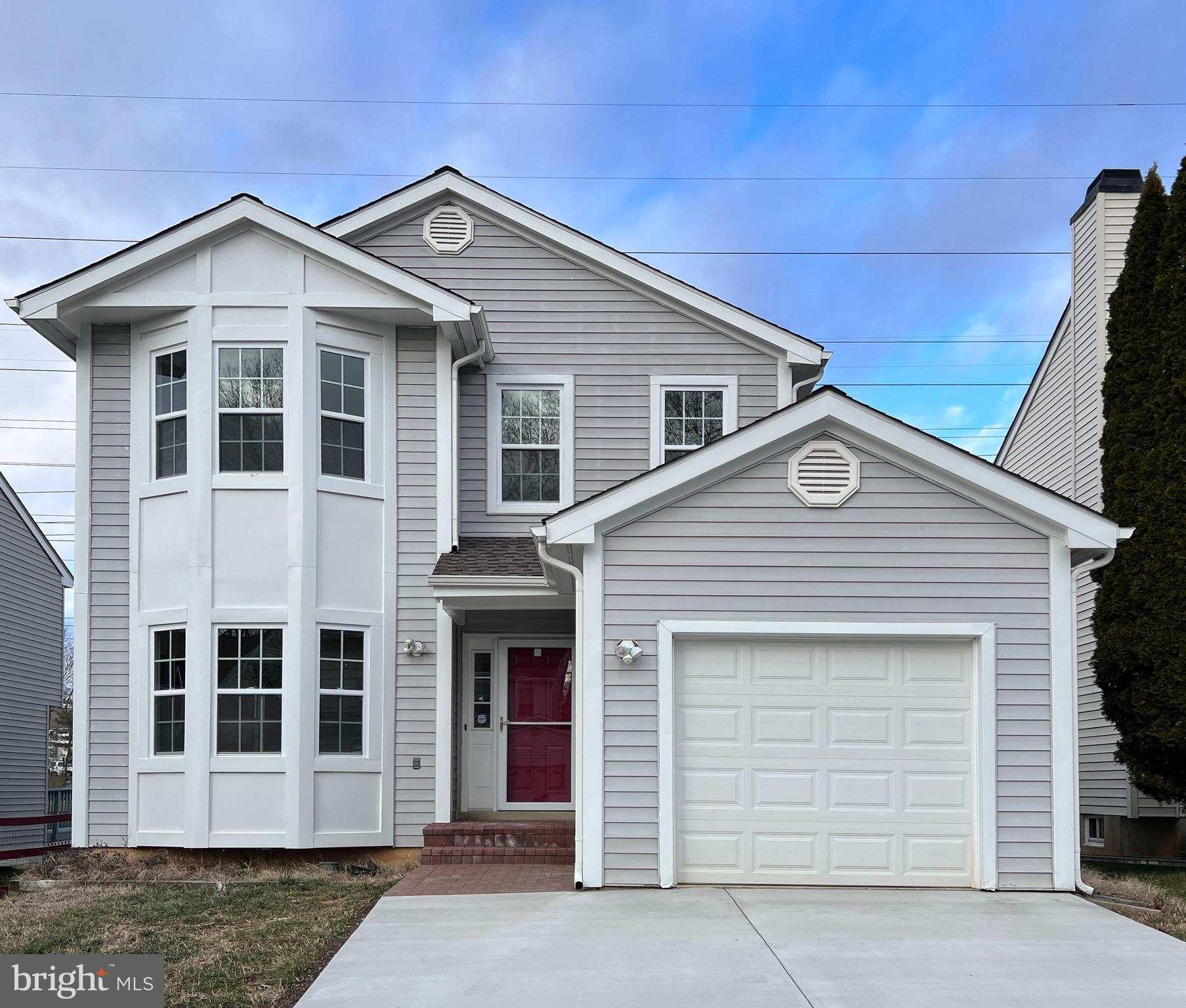 This beautiful 3BR/3.5BA detached home is situated on a beautiful tree-lined street, and boasts a freshly-painted, elegant open floor-plan with beautiful finishes. The house has been meticulously renovated from top to bottom with more than $100,000 in thoughtful new interior and exterior features: NEW elegant hardwood floors on two levels, NEW hardwood stairs, NEW deluxe carpets in the bedrooms, a fully updated kitchen with NEW appliances, NEW flooring, NEW lighting and NEW countertops, a luxurious NEW primary bathroom and exquisite updates to 3 more existing bathrooms, a recently NEW roof, furnace, windows and siding. Solar panels on the roof have reduced the electric bill to $20/month, sometimes $0! The large one-car garage is coupled with a NEW cement driveway with room for two more cars.  The flawless exterior siding and rear deck give the house a bright polish. The bedrooms' vaulted ceilings and large windows create a comfortable environment for modern family living. The lower level has very high ceilings, a full bathroom, a large rec room, and a den that could serve as a 4th bedroom.