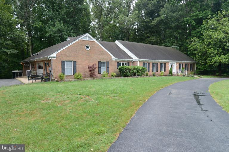 Price reduced!One level living in this unique all brick  rambler in this distinguished neighborhood in La Plata.  Indoor Pool w SKYLIGHTS ! Pool area has a full bath.Main part of the house has master bath a full bath,1/2 bathLots of hard wood floors.House can be handicap accessible. Porches overlooking the beautiful wooded backyard that leads to a lake.  Relax, enjoy...Separate inlaw apt.Must see!