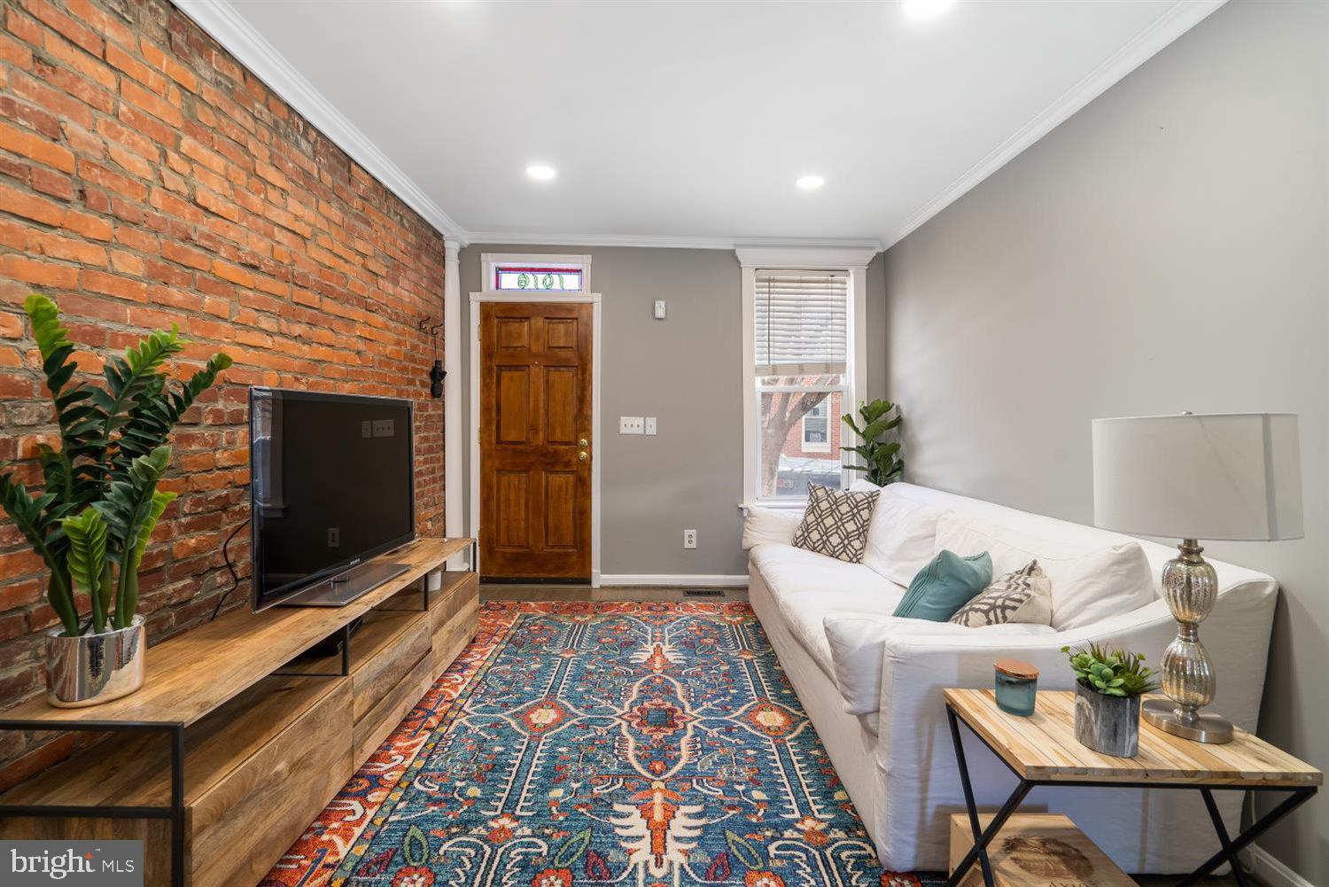 Charming Home That Fits Perfectly On This Picturesque Block In Canton! Open Concept Living With Hardwood Floors, Exposed Brick Throughout. The Updated Kitchen Offers White Shaker Cabinets, Marble Backsplash, Sleek Concrete Countertops and Stainless Steel Appliances.  The Laundry and Half Bathroom Are Located On The Main Floor. The Upper Level Offers Two Spacious Bedrooms, With The Larger Room In The Front And The Second Bedroom Towards the Back, And With Rear Deck Off The Second Floor, And Patio Out Back. Unfinished Basement With Storage, Close To I-95, Target, Harris Teeter, Restaurants, Bars, and Canton Square.  ****Bonus Features Include: New Paint & Carpeting Throughout, New Blinds, New Recessed Lighting Downstairs & In Master Bedroom, New Upstairs Bath, &, New Light Fixtures.****