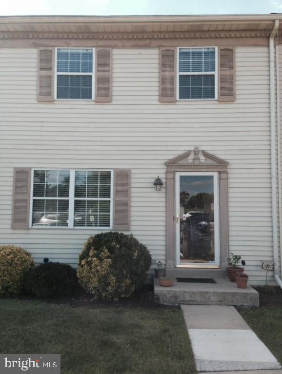 Upgraded laminate flooring on first floor, central air, ceramic tile details in kitchen and bathroom, private patio overlooking Waterfront River and Flory Park with pavilion, playground, walking trails.  Two parking spaces, 1st FL laundry, Pella patio doors. Beautiful move-in ready home! Must see!