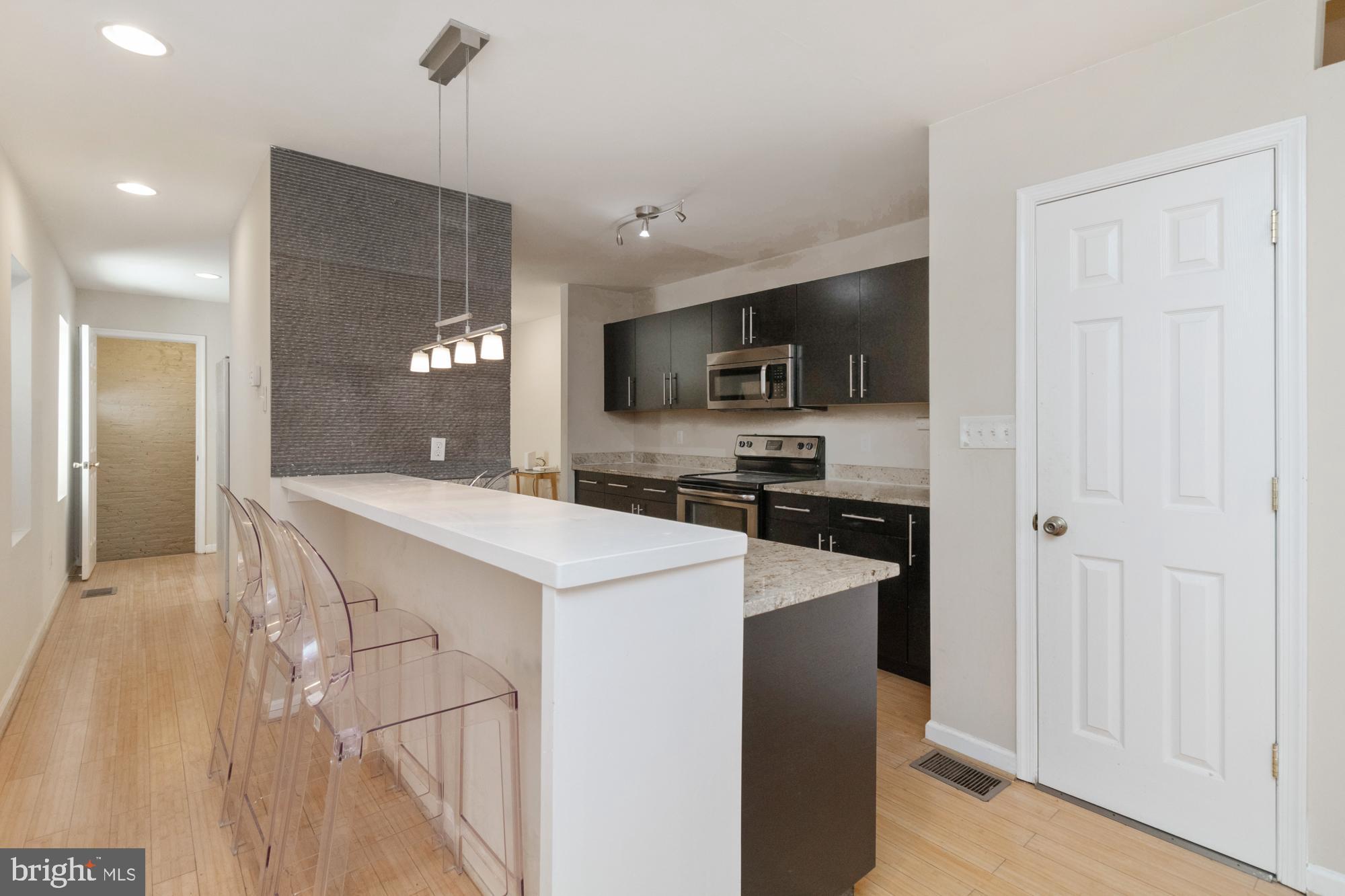 Ask me how to purchase this home with 100% Financing plus a $5000 GRANT!  Welcome to this stunning 4-bedroom, 3.5-bathroom end-unit townhome featuring a side-entry garage and an abundance of space! This home is being sold fully furnished, making it move-in ready for the next lucky owner. The entry level offers a bright, open-concept design with hardwood floors, a spacious kitchen equipped with granite countertops, a breakfast bar adorned with pendant lighting, stainless steel appliances, and a dining area. Large side windows fill the space with natural light. A convenient half bath completes this level.
Upstairs, the primary suite boasts a walk-in closet and en-suite bath, while two additional bedrooms share a modern hall bath. Enjoy direct access to a large deck, perfect for relaxing and entertaining. The fully finished lower level offers a versatile family room, a fourth bedroom, a full bath, and a laundry room, providing extra comfort and convenience.
Located in a prime spot, this home is within walking distance to the newly renovated Northeast Market, Johns Hopkins, and just a short trip to downtown Baltimore. A perfect blend of style, space, and location—don't miss out! GREAT PROPERTY AN INVESTOR! This spacious home is a fantastic opportunity for investors looking for immediate rental income. With two of the four bedrooms featuring en suite bathrooms, this property offers convenience and privacy, making it highly attractive to tenants. The home is well-maintained and ready for new occupants. Lead Free Certification (free and clear of lead) and Rental Registration through 12/31/25. Easily and quickly renewable when current registration expires. Great property for med students.

With an estimated potential rent of $3,400 per month, this property promises excellent returns on investment. Don't miss this chance to add a lucrative asset to your portfolio!